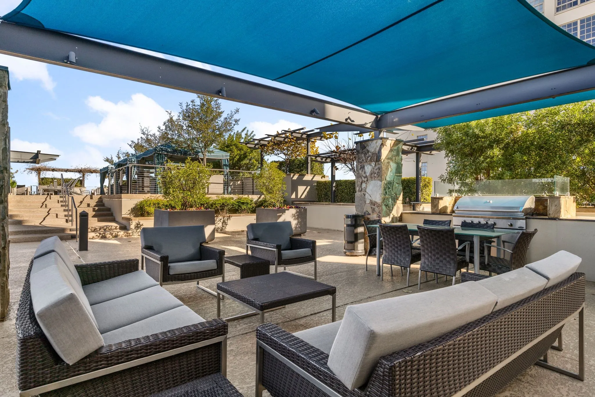 View of patio featuring an outdoor kitchen, an outdoor hangout area, outdoor dining space, and a pergola