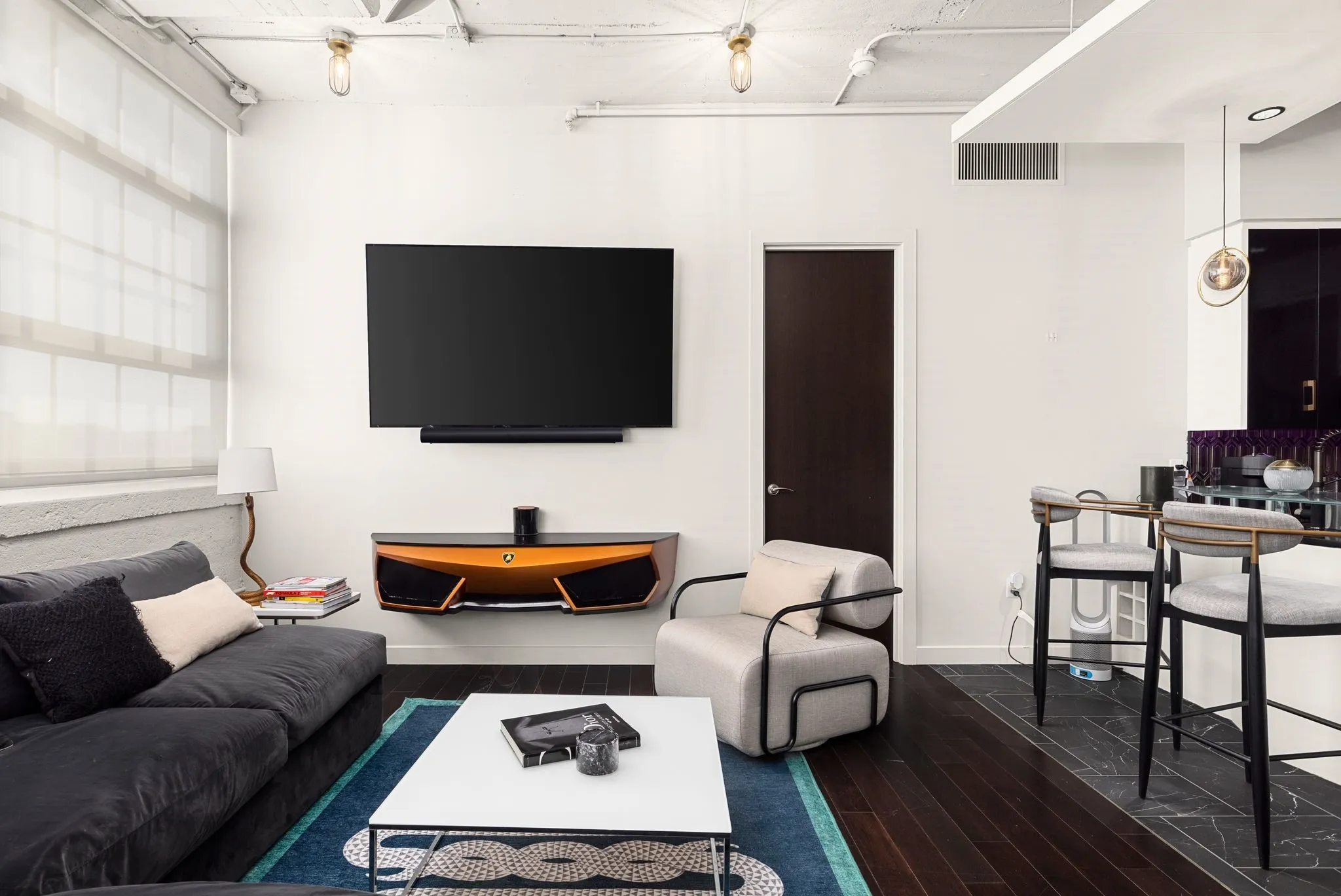 Living room with dark wood-style flooring