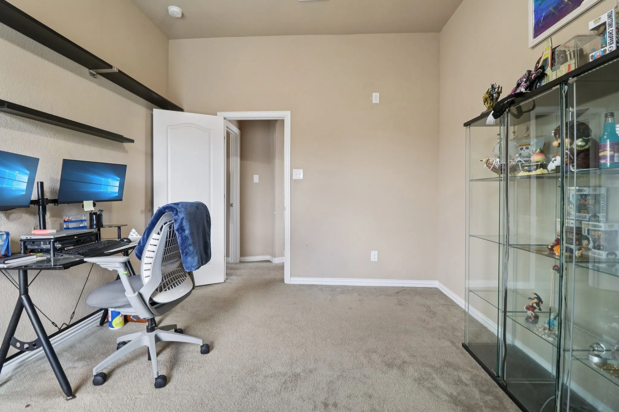 Office space featuring carpet floors and baseboards