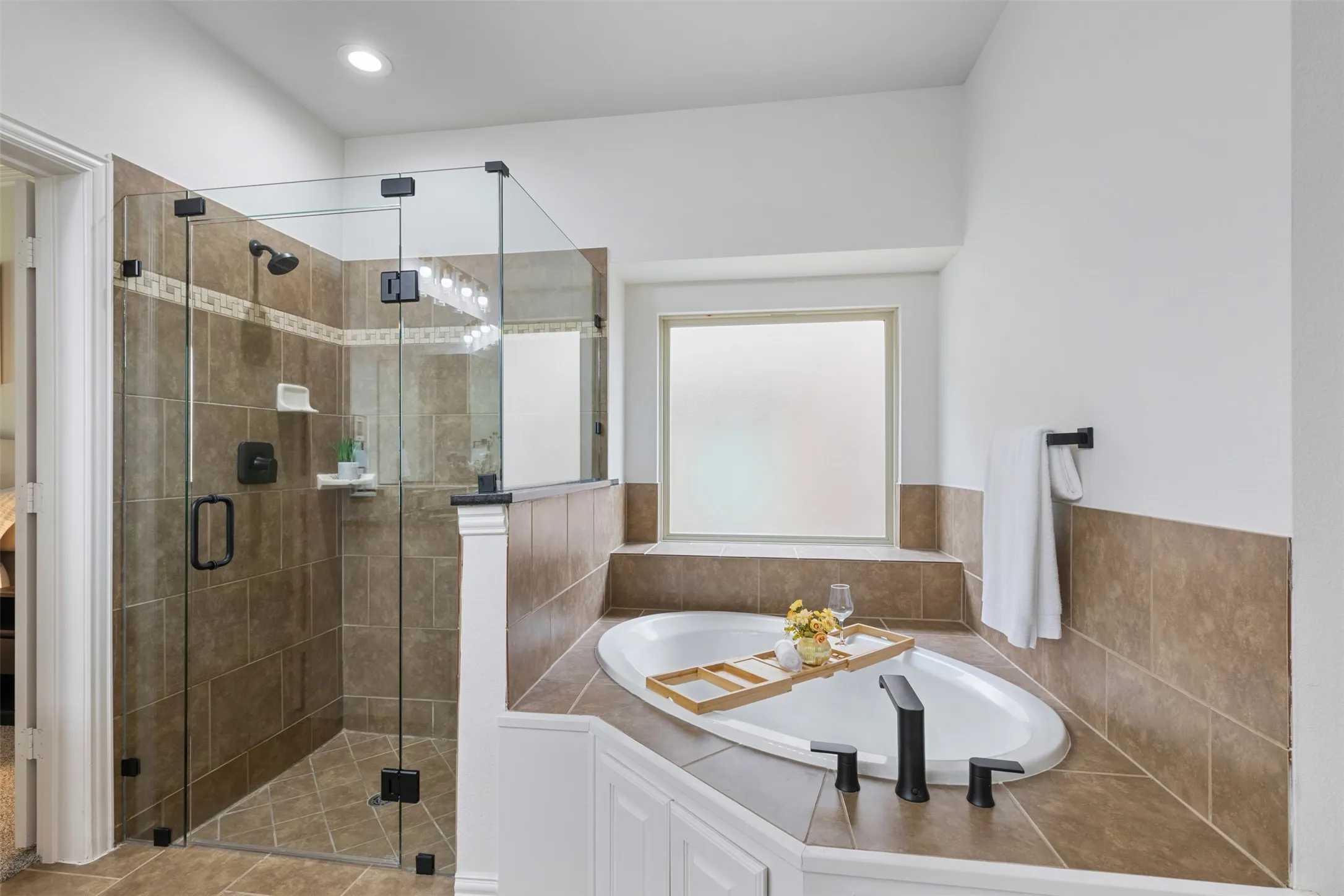 Full bathroom with a shower stall and a garden tub