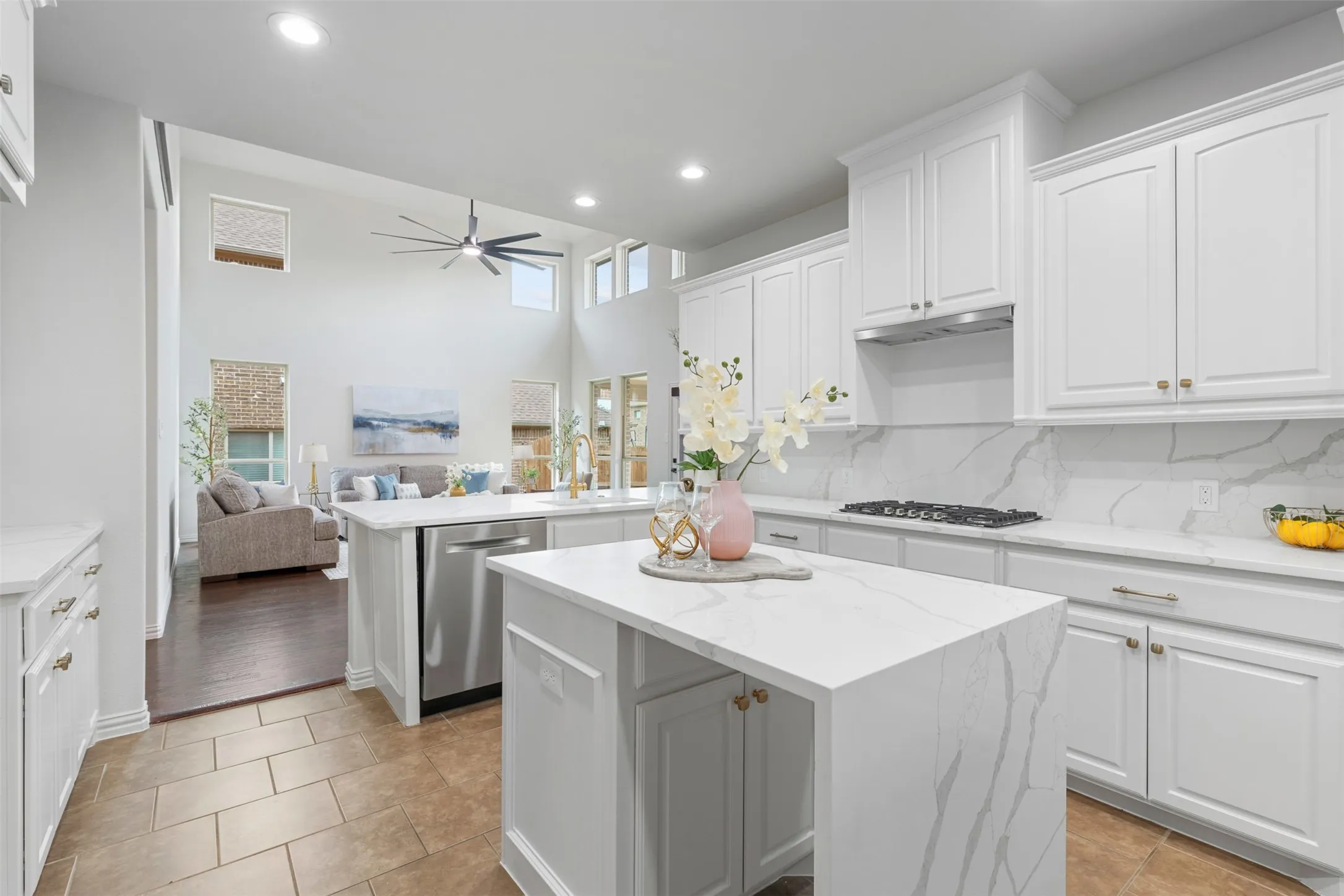 Kitchen featuring recessed lighting, dishwasher, gas stovetop, a center island, and a ceiling fan