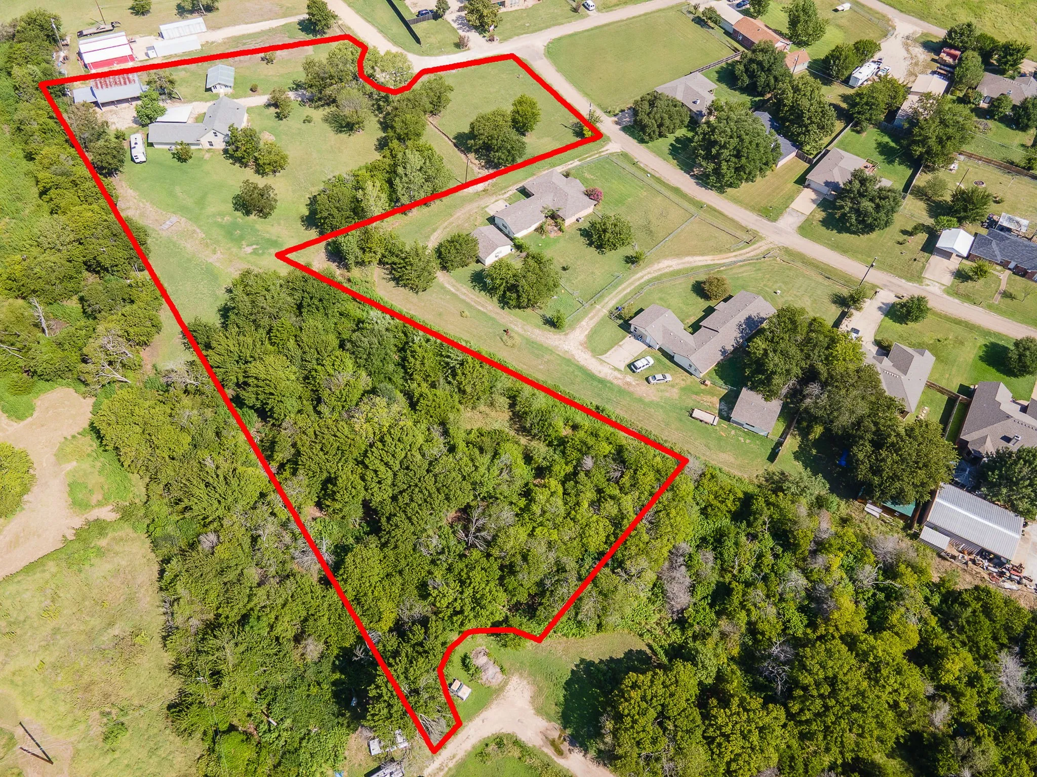 Aerial view of property and surrounding area with property boundaries highlighted