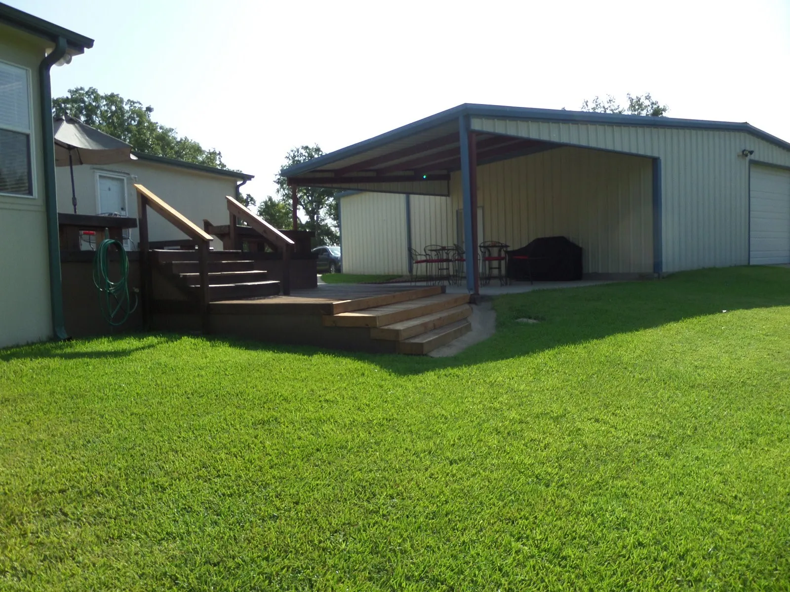View of Deck and patio attached to Garage/Workshop
