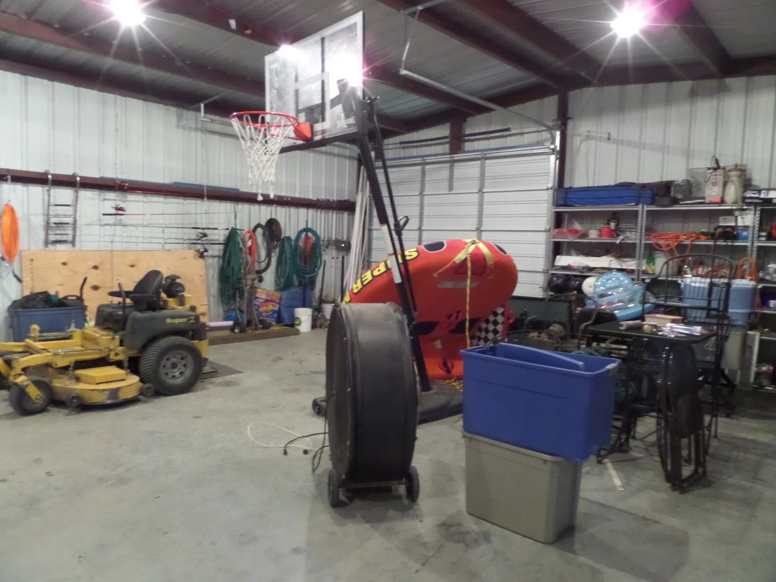 Garage featuring metal wall and a workshop area