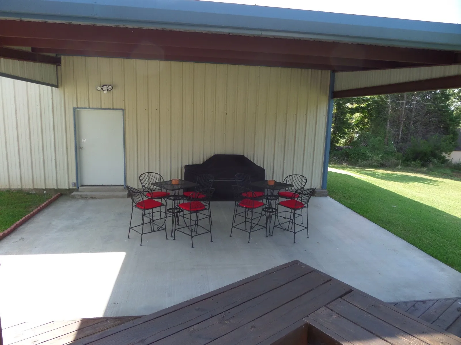 View of patio / terrace featuring outdoor dining space and a wooden deck