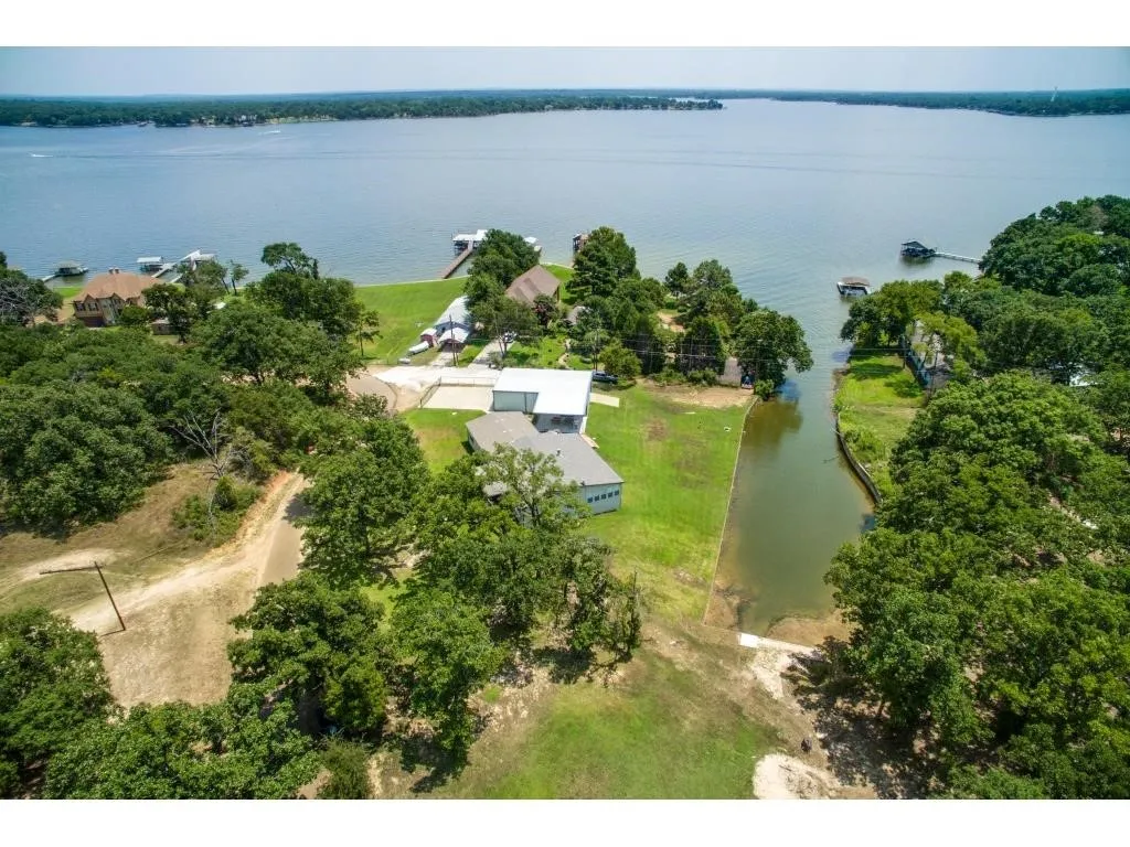 Aerial view of property and on the lake.