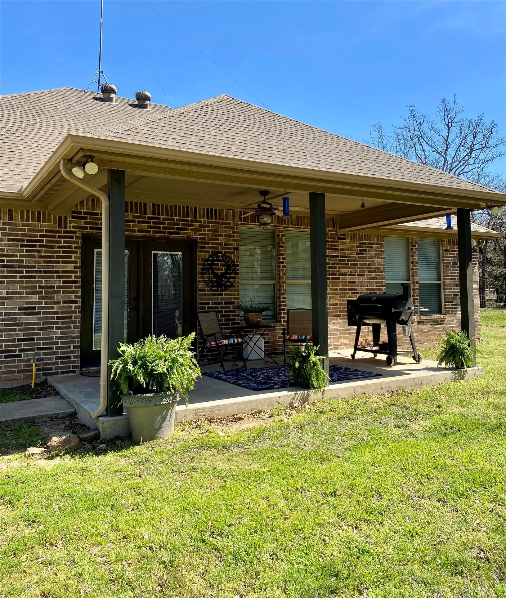 Enjoy entertaining on your covered patio and huge, wooded backyard!