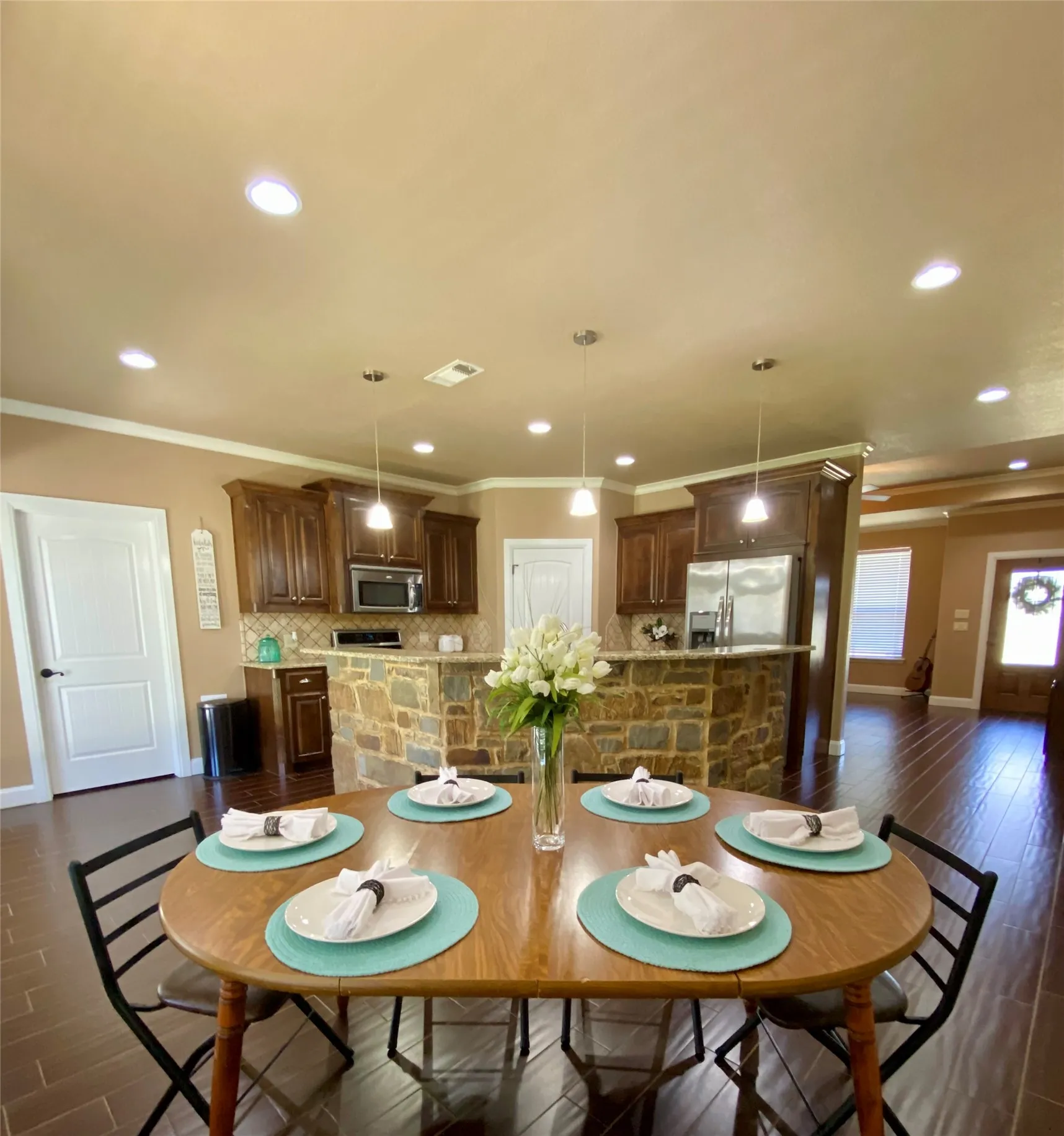 Kitchen features ss appliances, granite countertops, and pantry