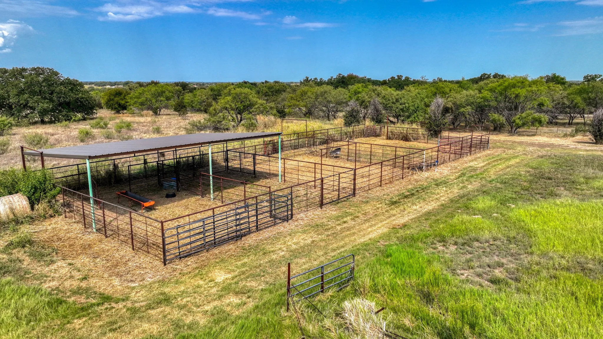 View of yard with a view of countryside, an exterior structure, and an outdoor structure