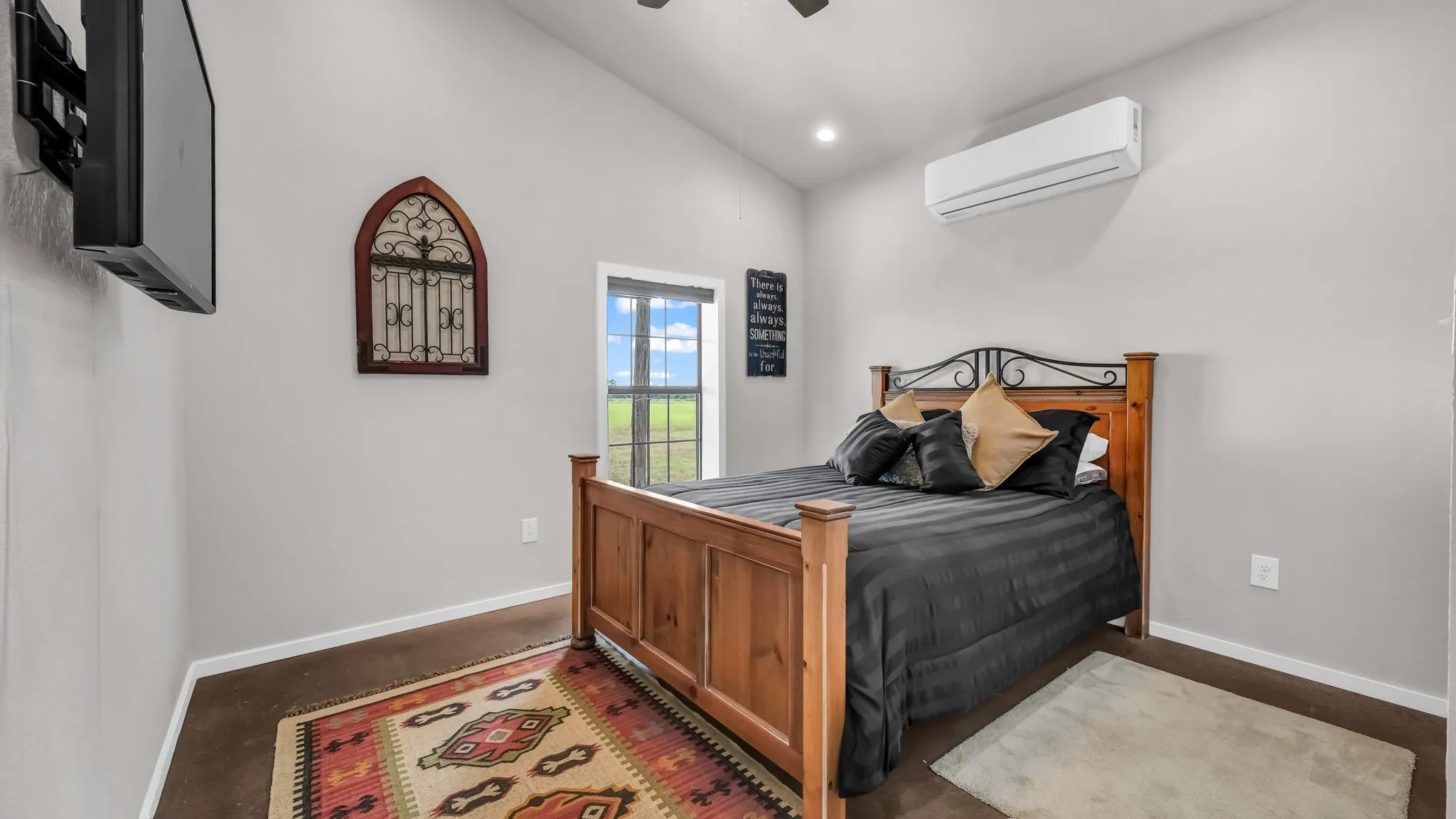 Bedroom with an AC wall unit, a ceiling fan, recessed lighting, and lofted ceiling