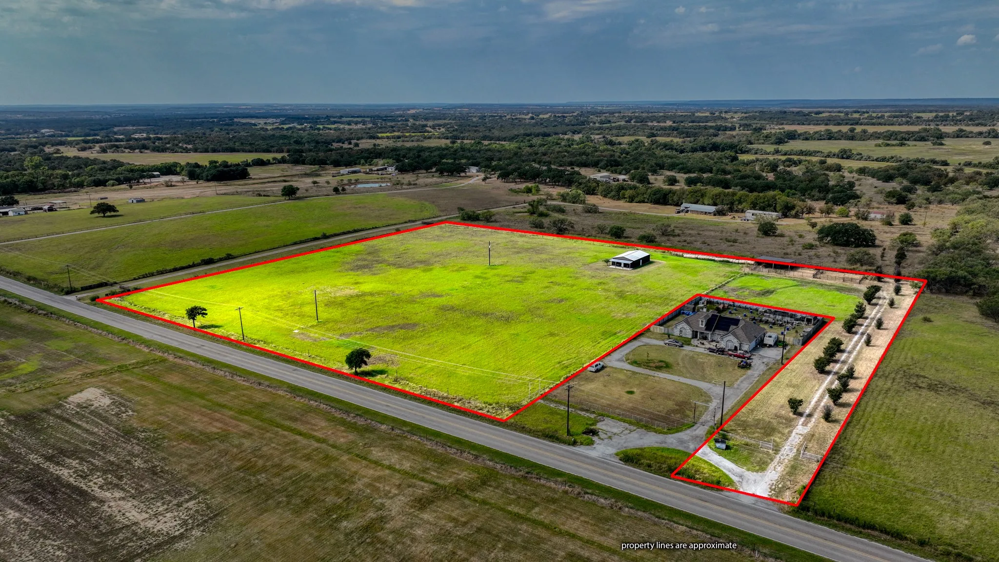 Aerial view of sparsely populated area featuring property boundaries highlighted