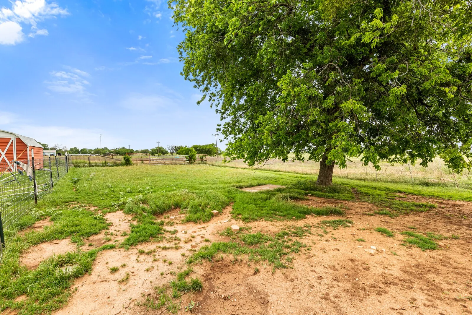 View of yard with a rural view