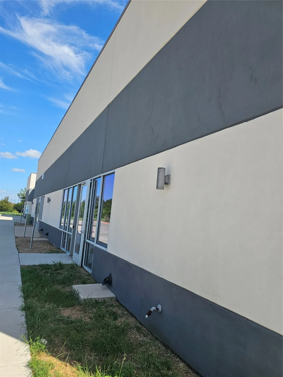 View of side of home with stucco siding
