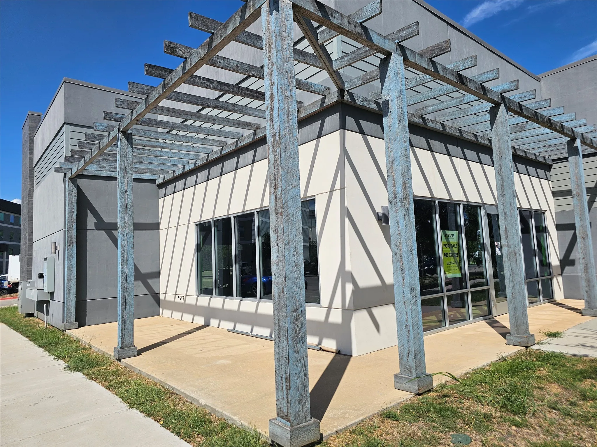 View of property exterior with a pergola
