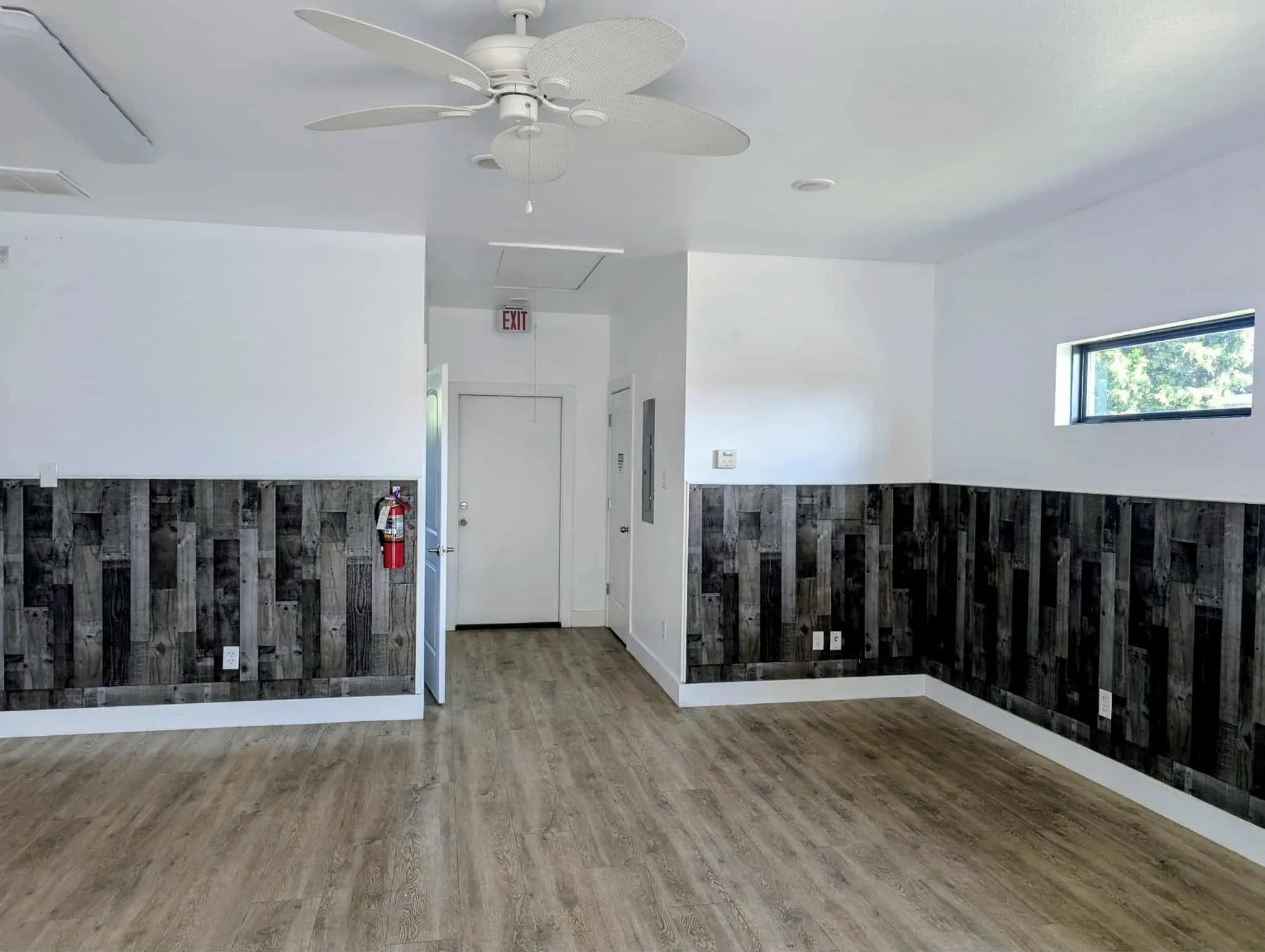 View from the front door.  ADA restroom is on the left.  Small office or storage space on the right.