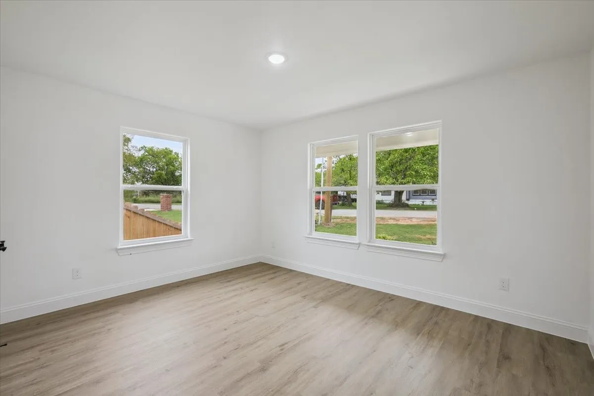Spare room featuring light wood-style flooring and recessed lighting