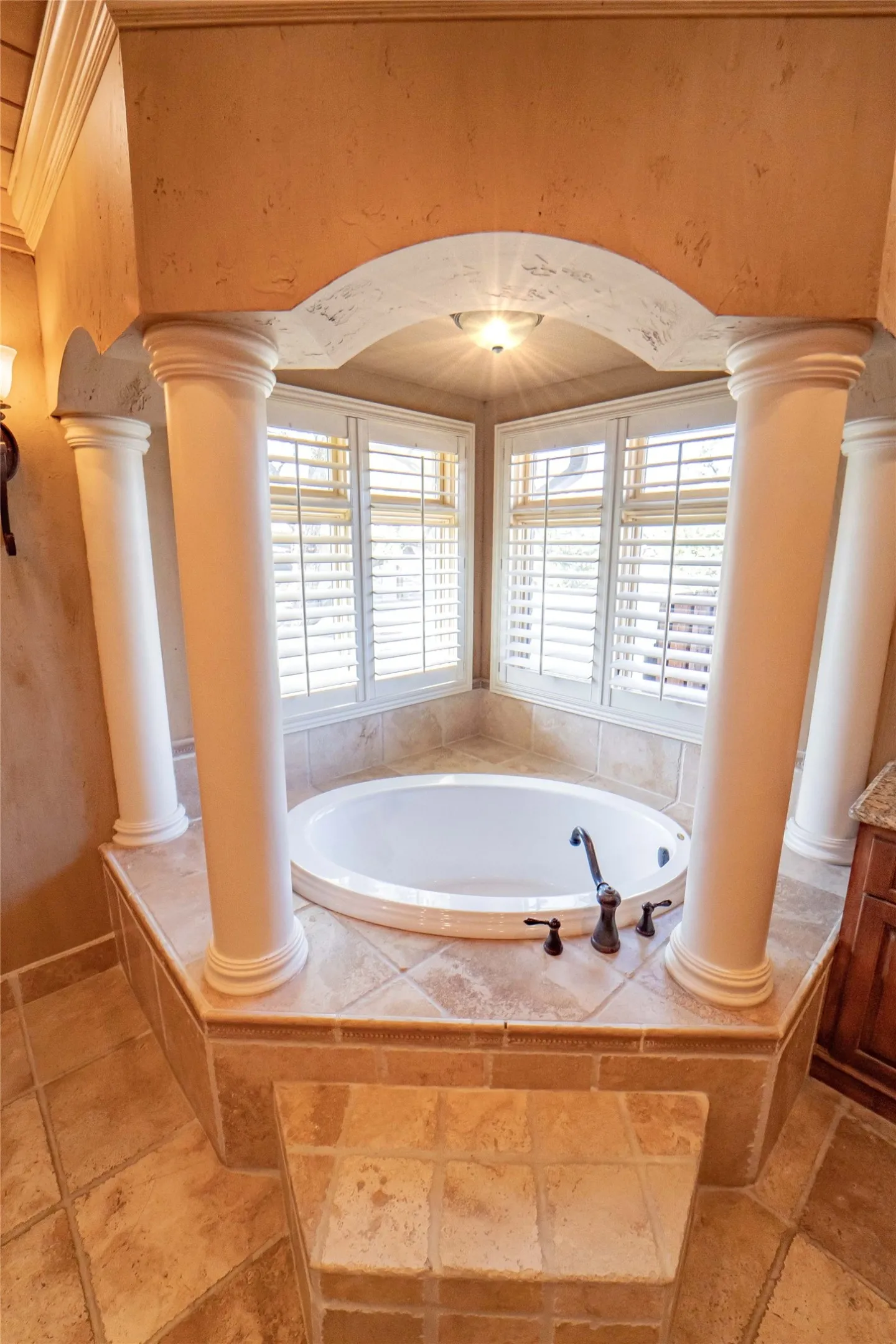 Elegant primary bath with columned soaking tub!