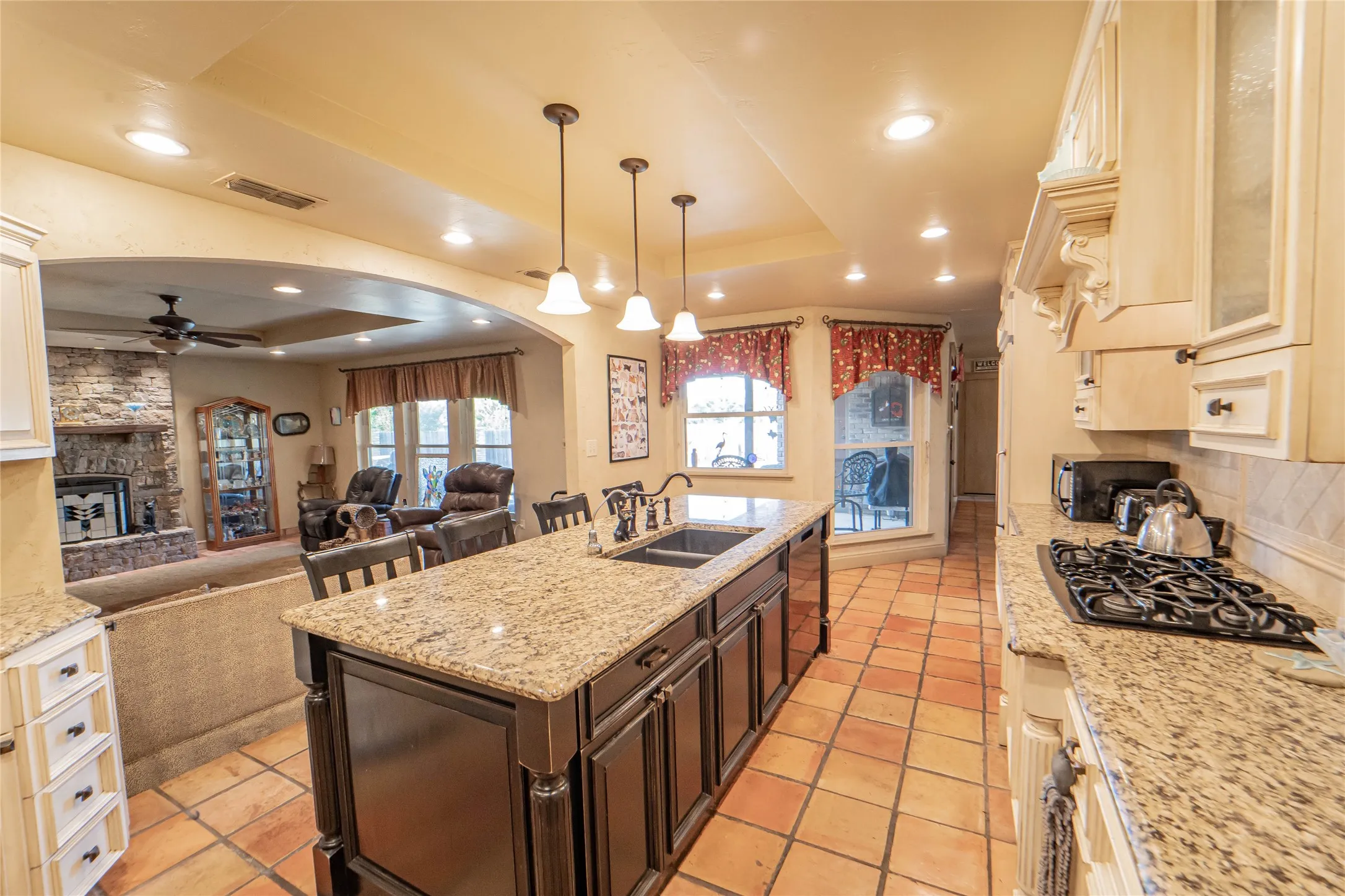Open-concept kitchen flows seamlessly into living and dining areas-perfect for entertaining.
