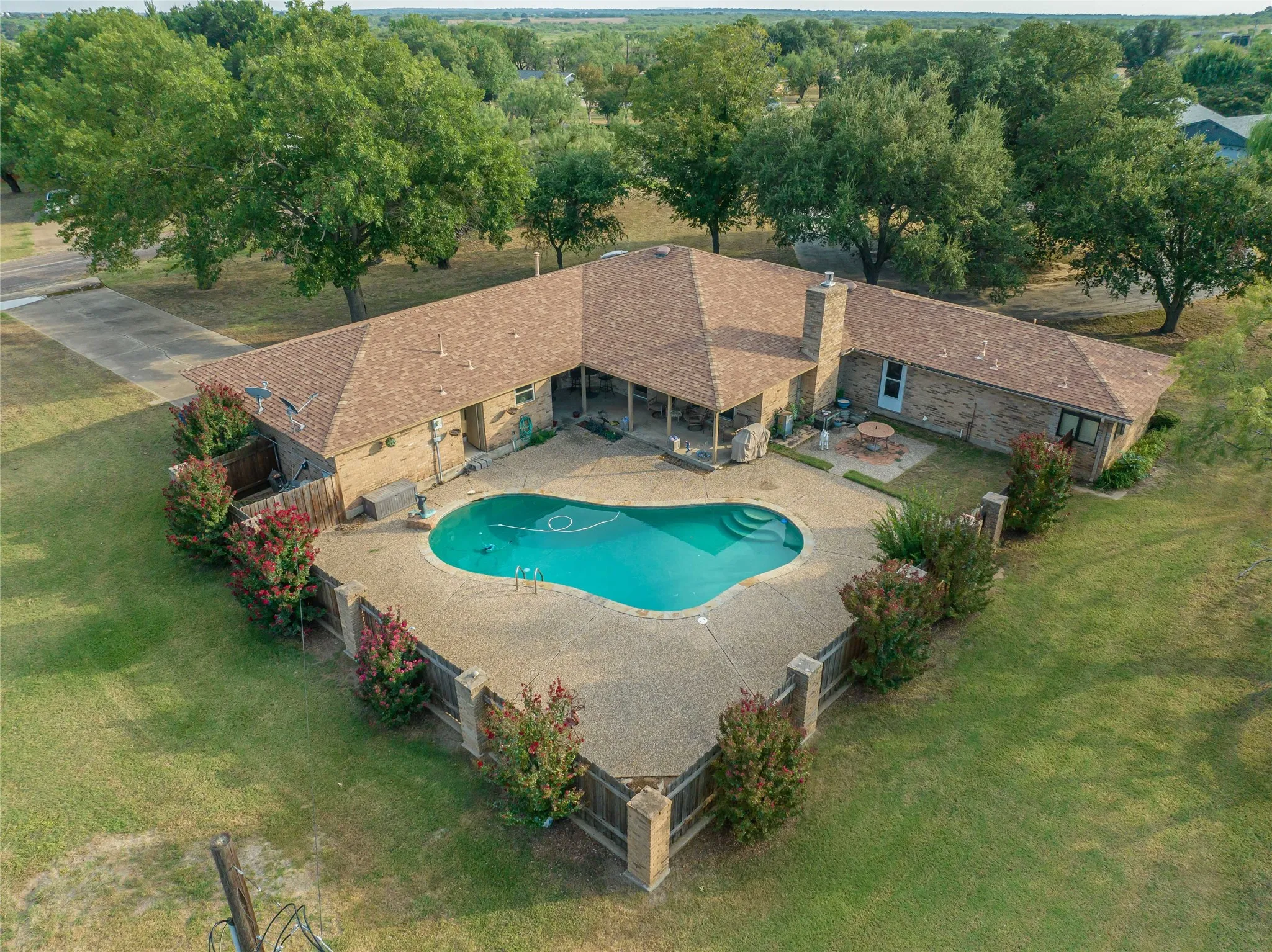 Covered patio and poolside views create the perfect space for outdoor living-perfect for relaxing and entertaining.