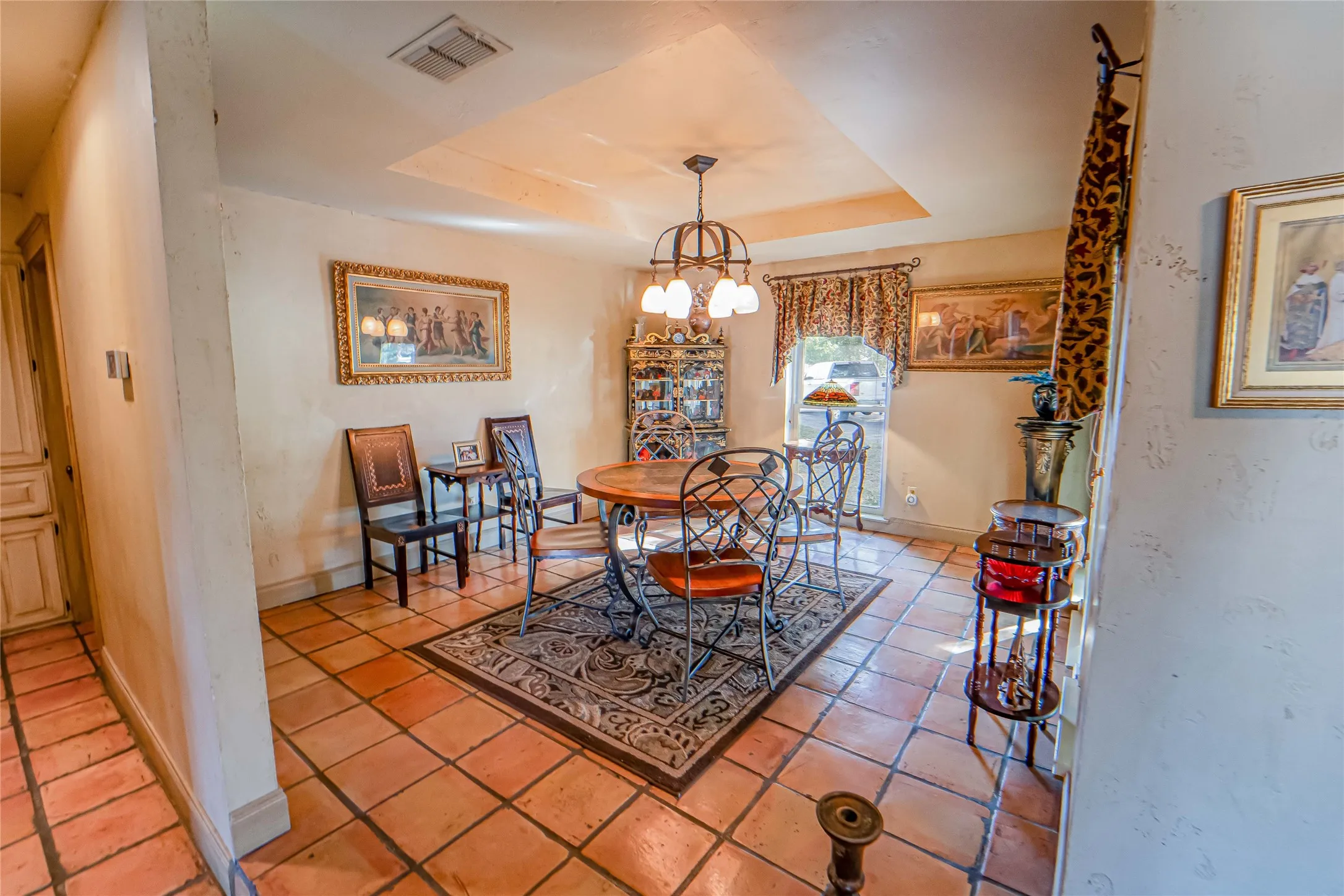 Beautiful dining area with tray ceiling and great natural lighting!