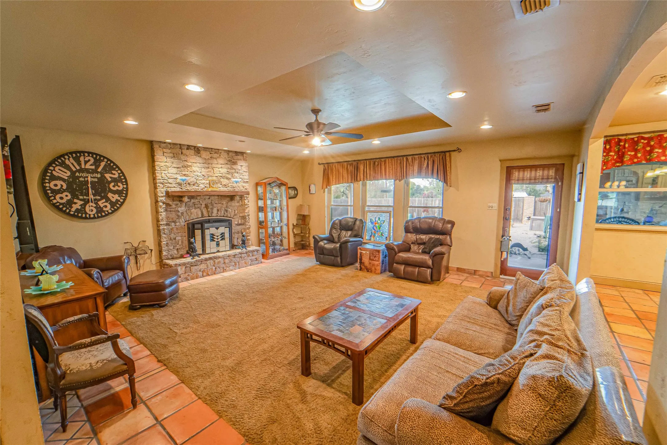 Living room offers great natural lighting and pool/patio views!
