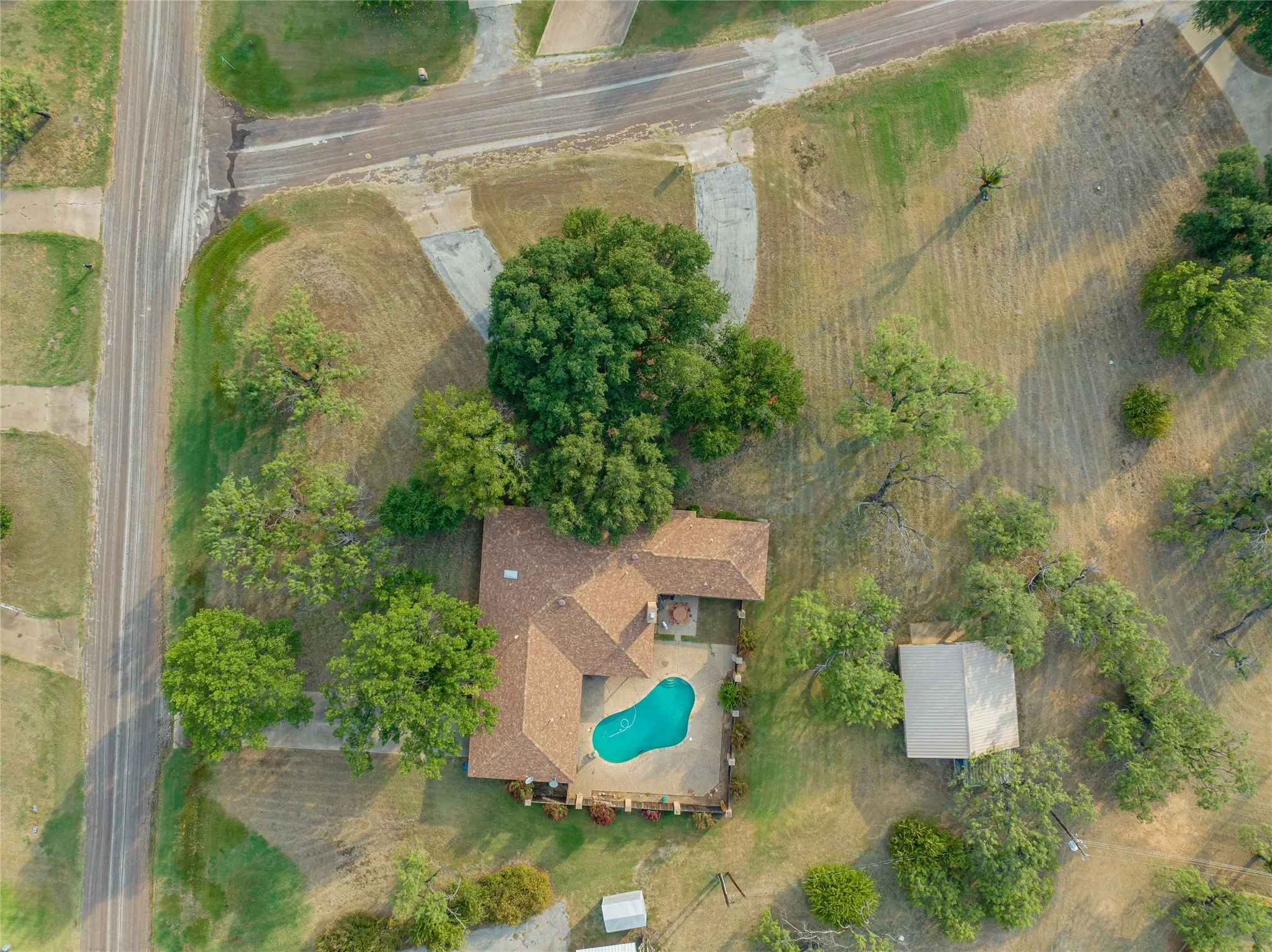 Aerial View showcasing showcasing the home wrapping the patio/pool area!