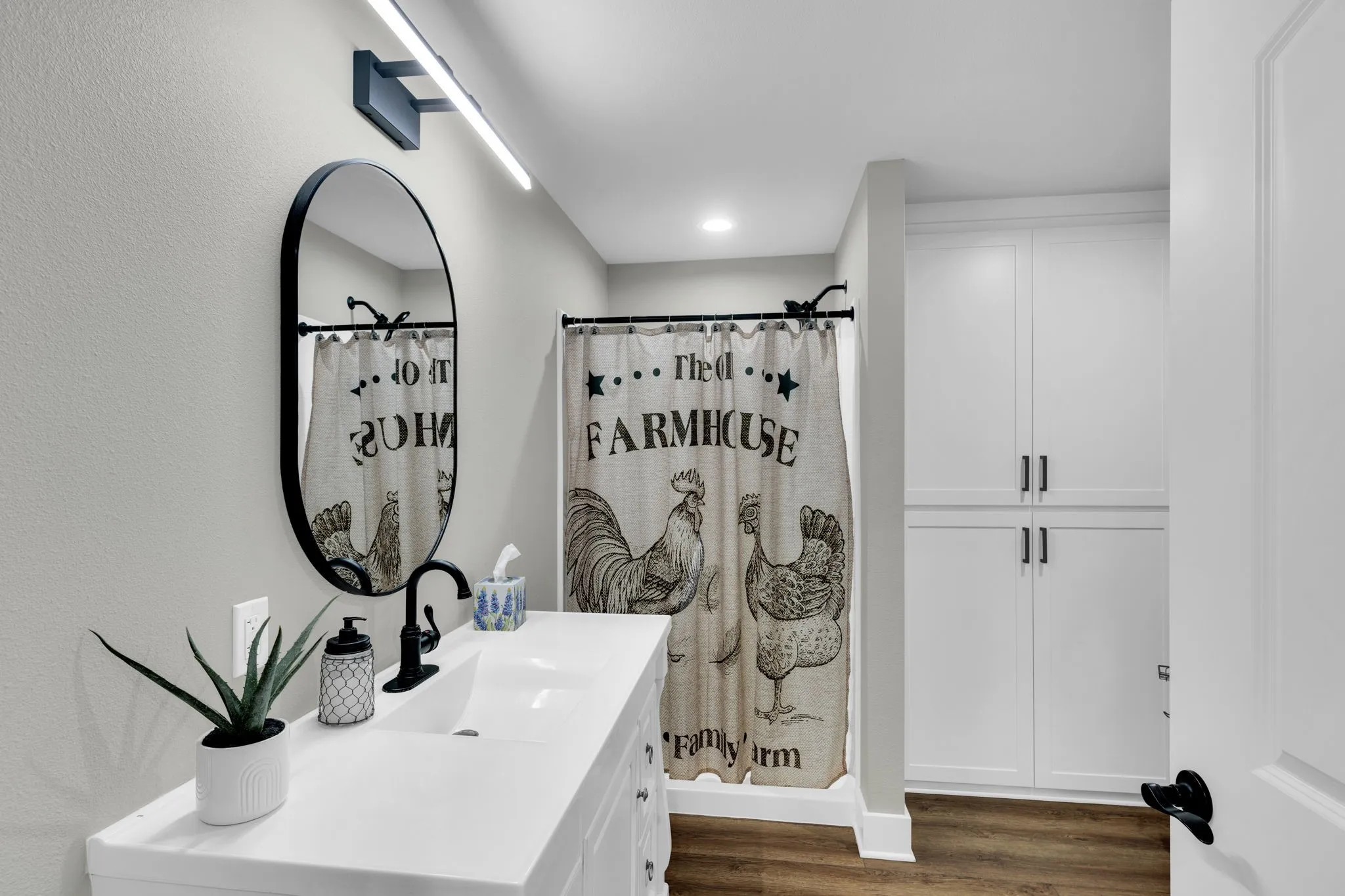 Full bathroom off foyer hallway