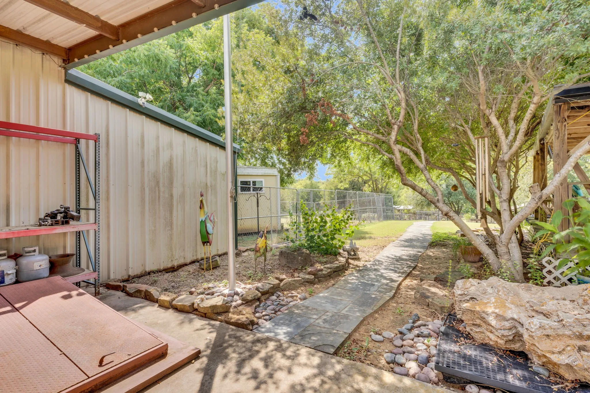 side of workshop with walkway to chicken area