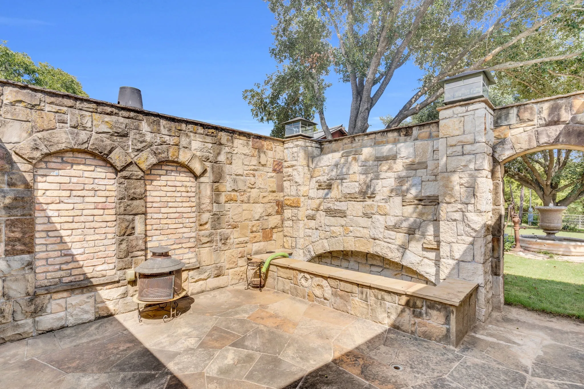 Master suite private patio with waterfall wall