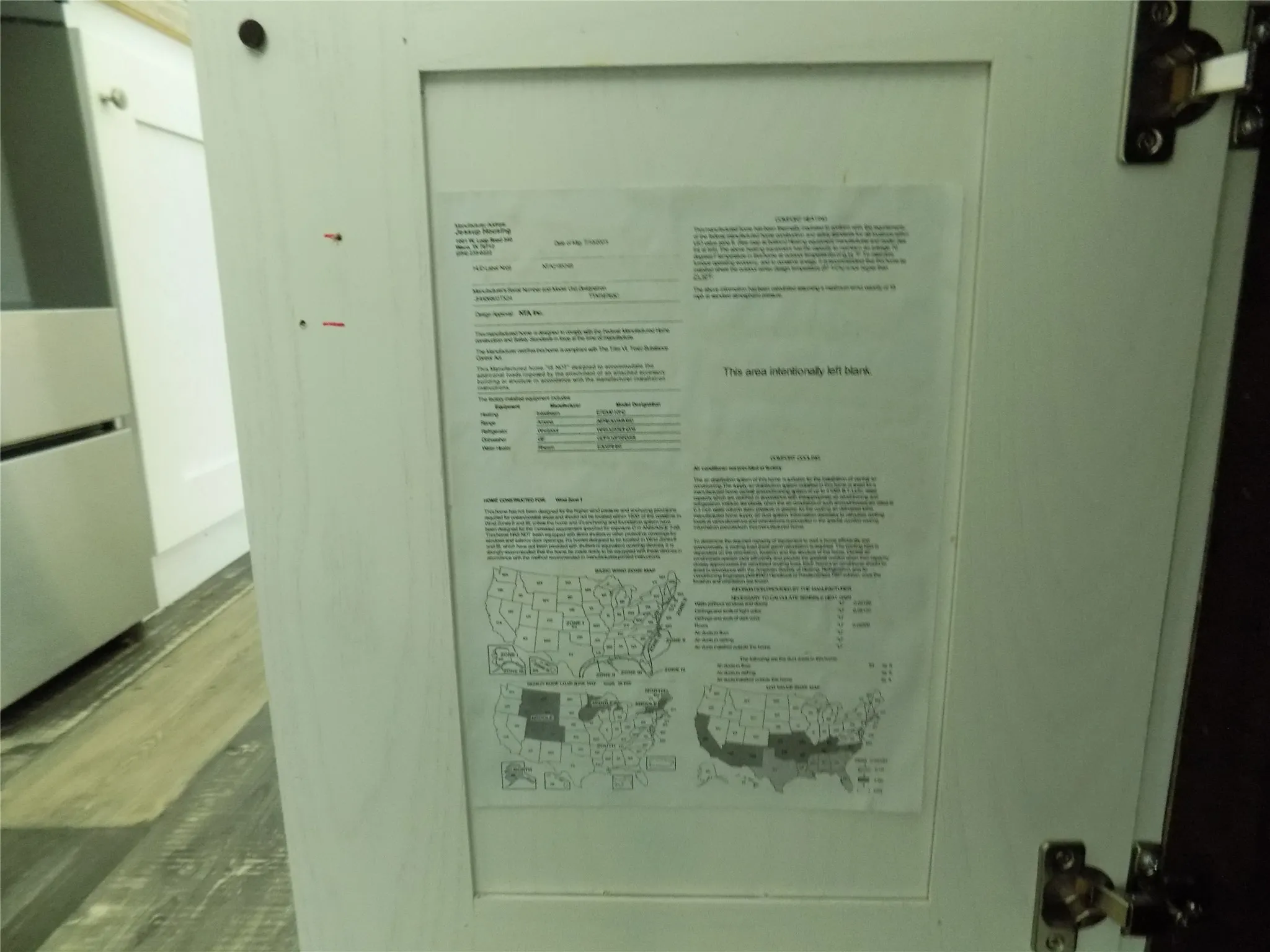 Manufacturer information found on kitchen cabinet doors.