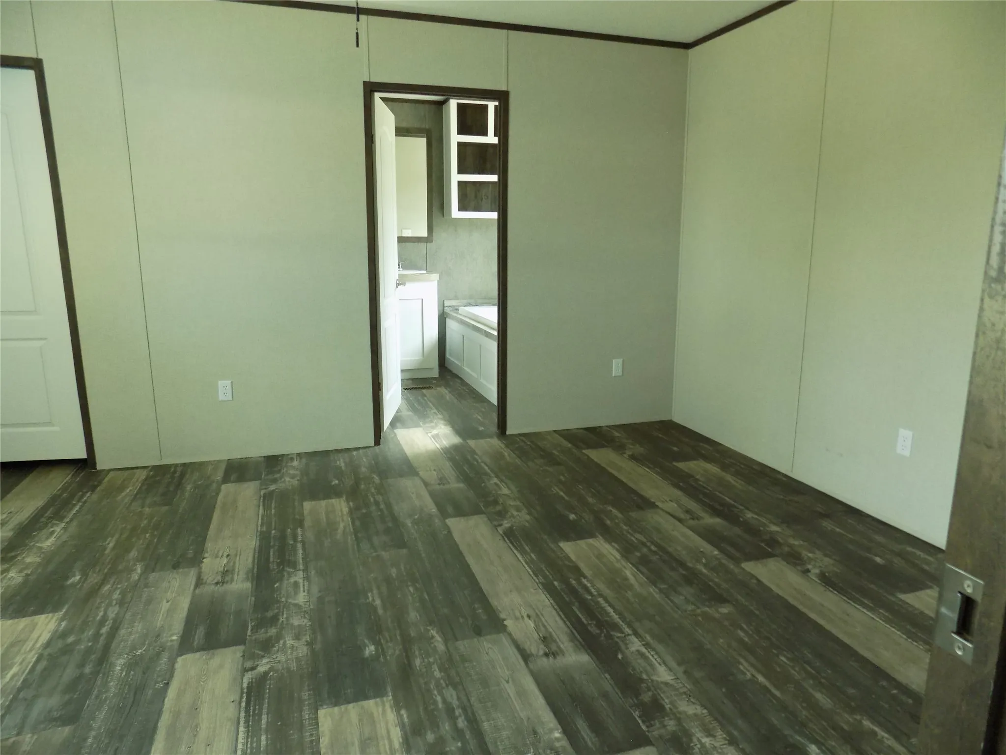 Enter into large primary bedroom,