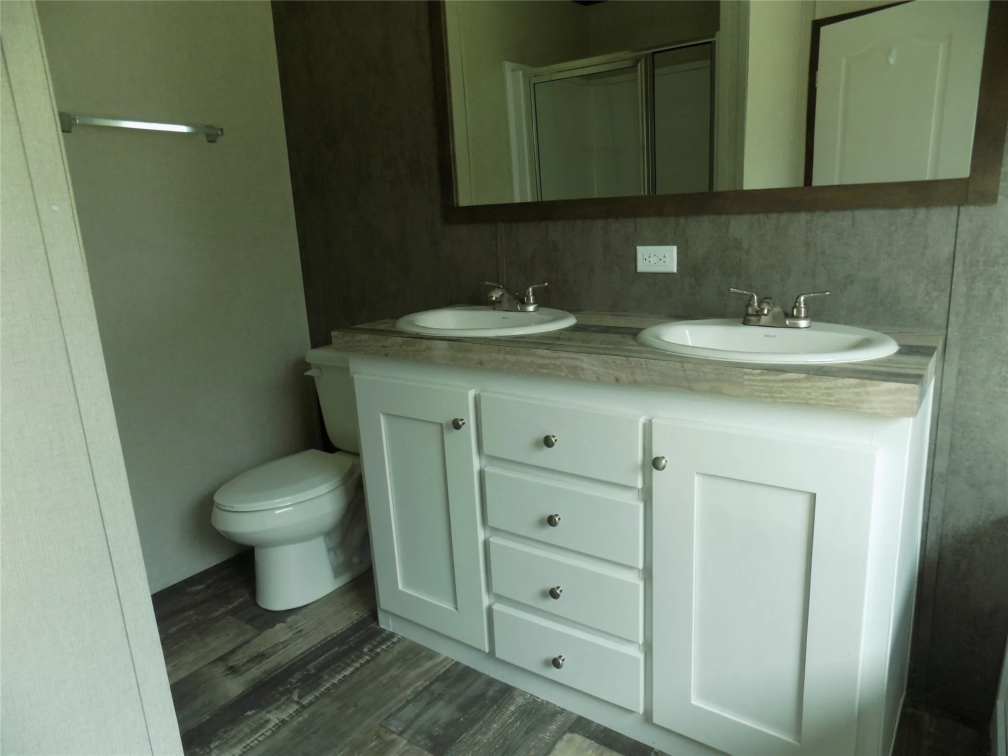 Dual sinks and separate shower in primary bedroom bathroom. Very roomy.