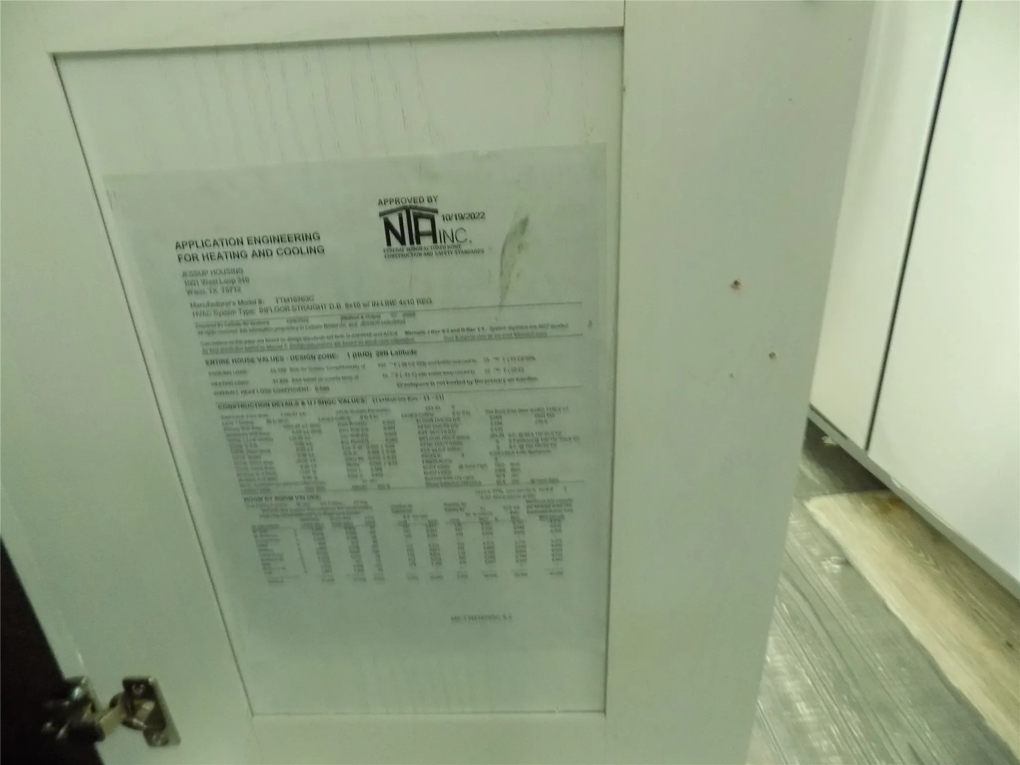 Manufacturer information found on kitchen cabinet doors.
