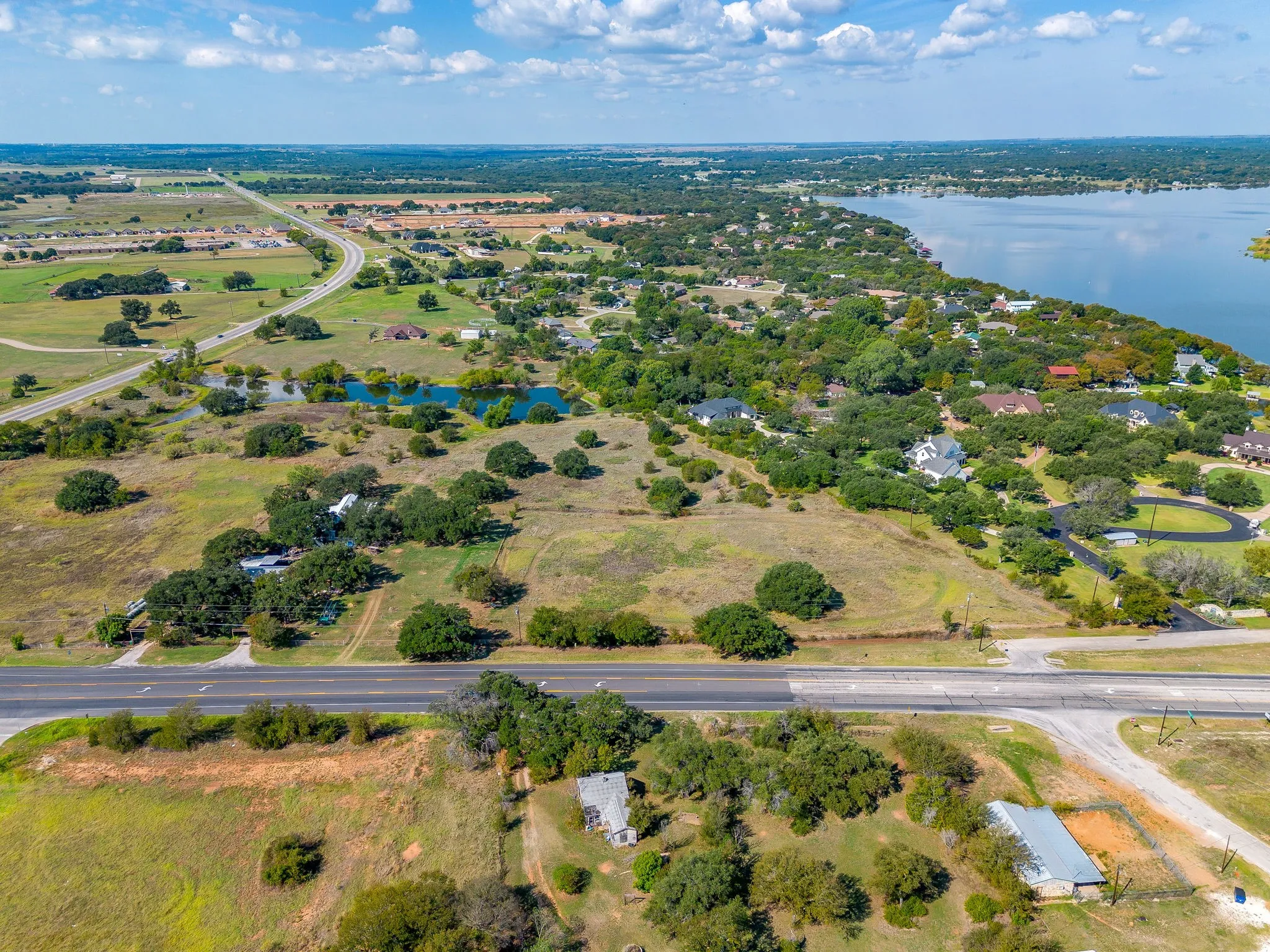 Aerial overview of property's location featuring a nearby body of water