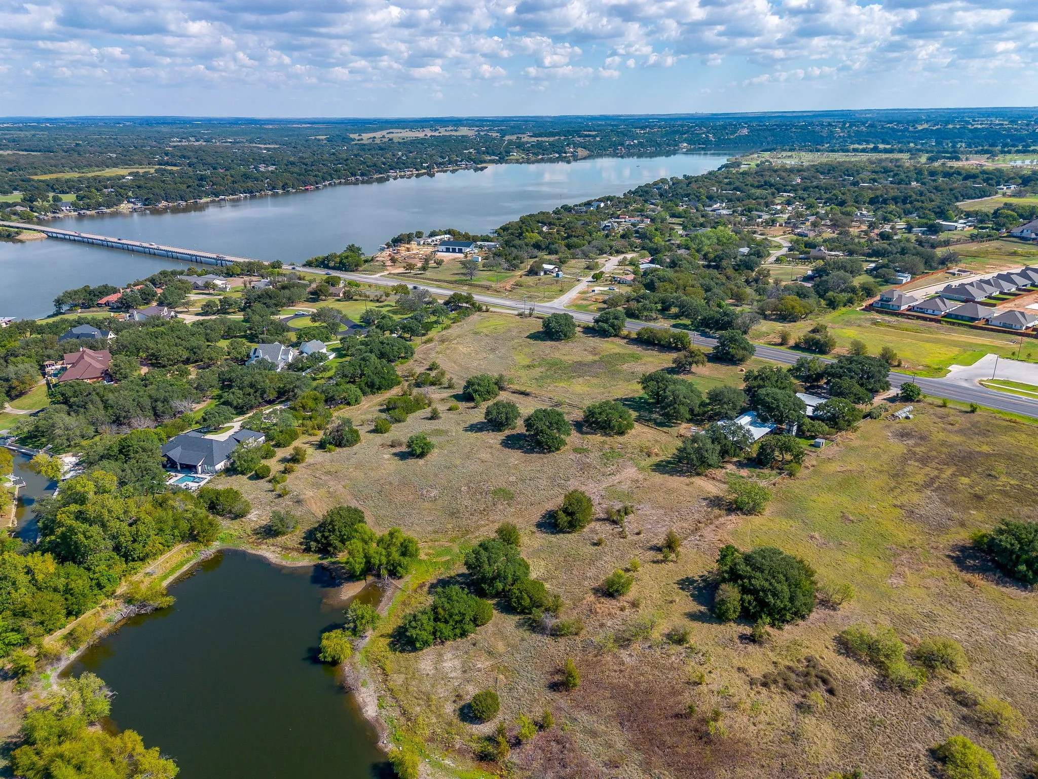 Aerial view of property's location featuring a nearby body of water and a notable bridge