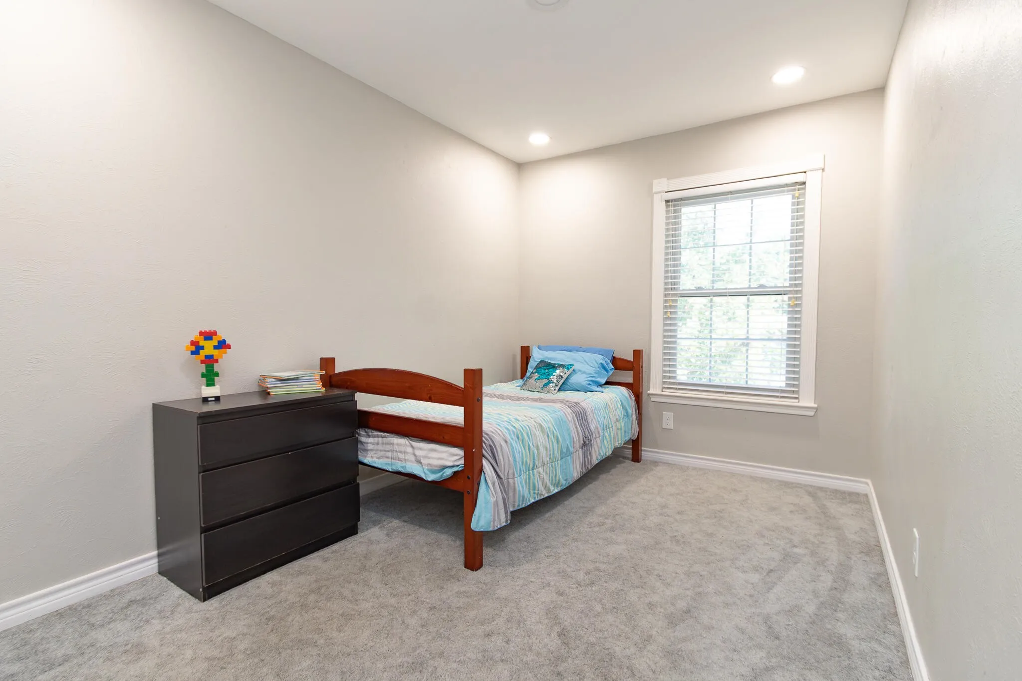 Bedroom featuring light colored carpet and recessed lighting