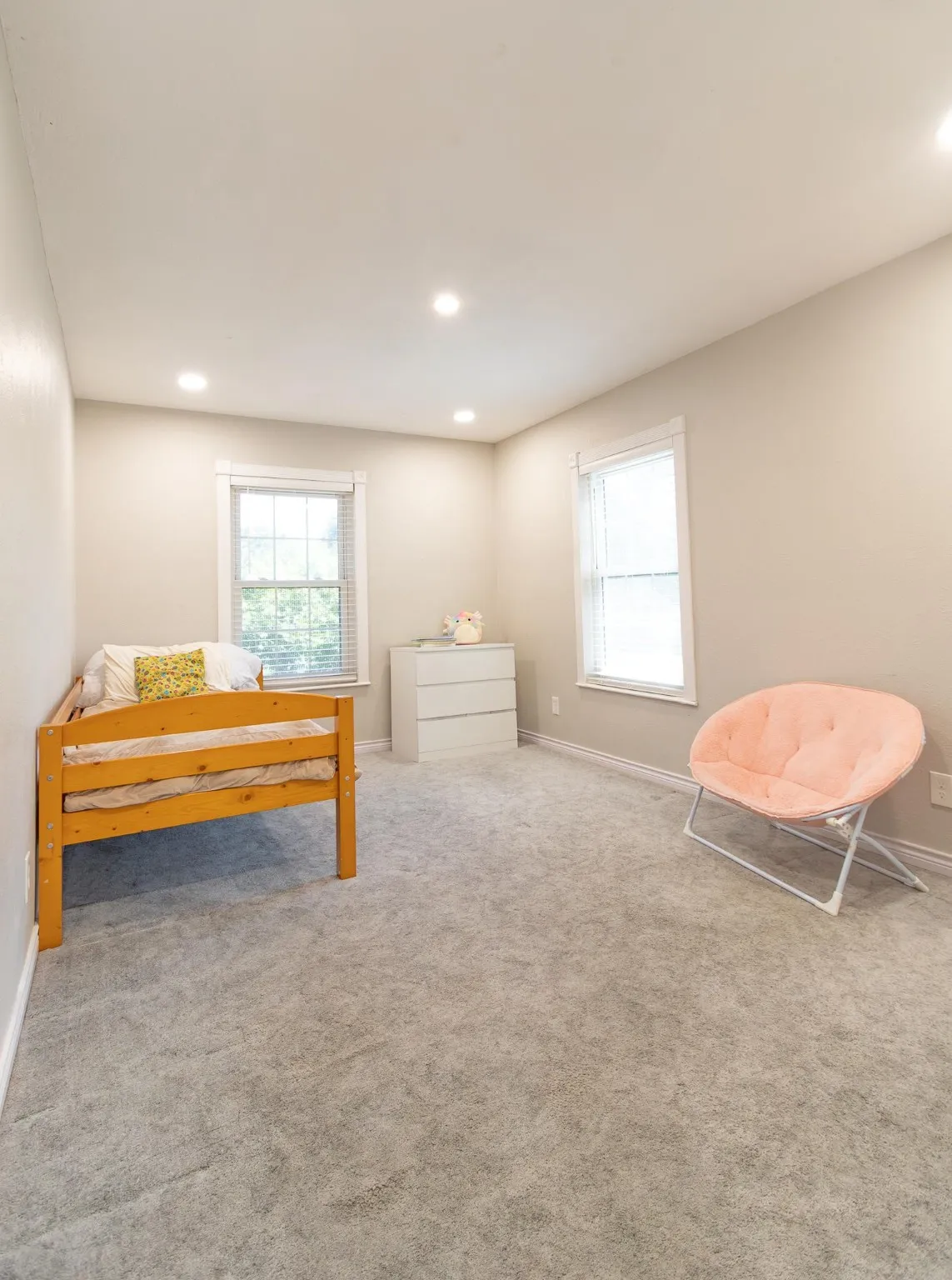 Bedroom featuring carpet flooring, recessed lighting, and multiple windows