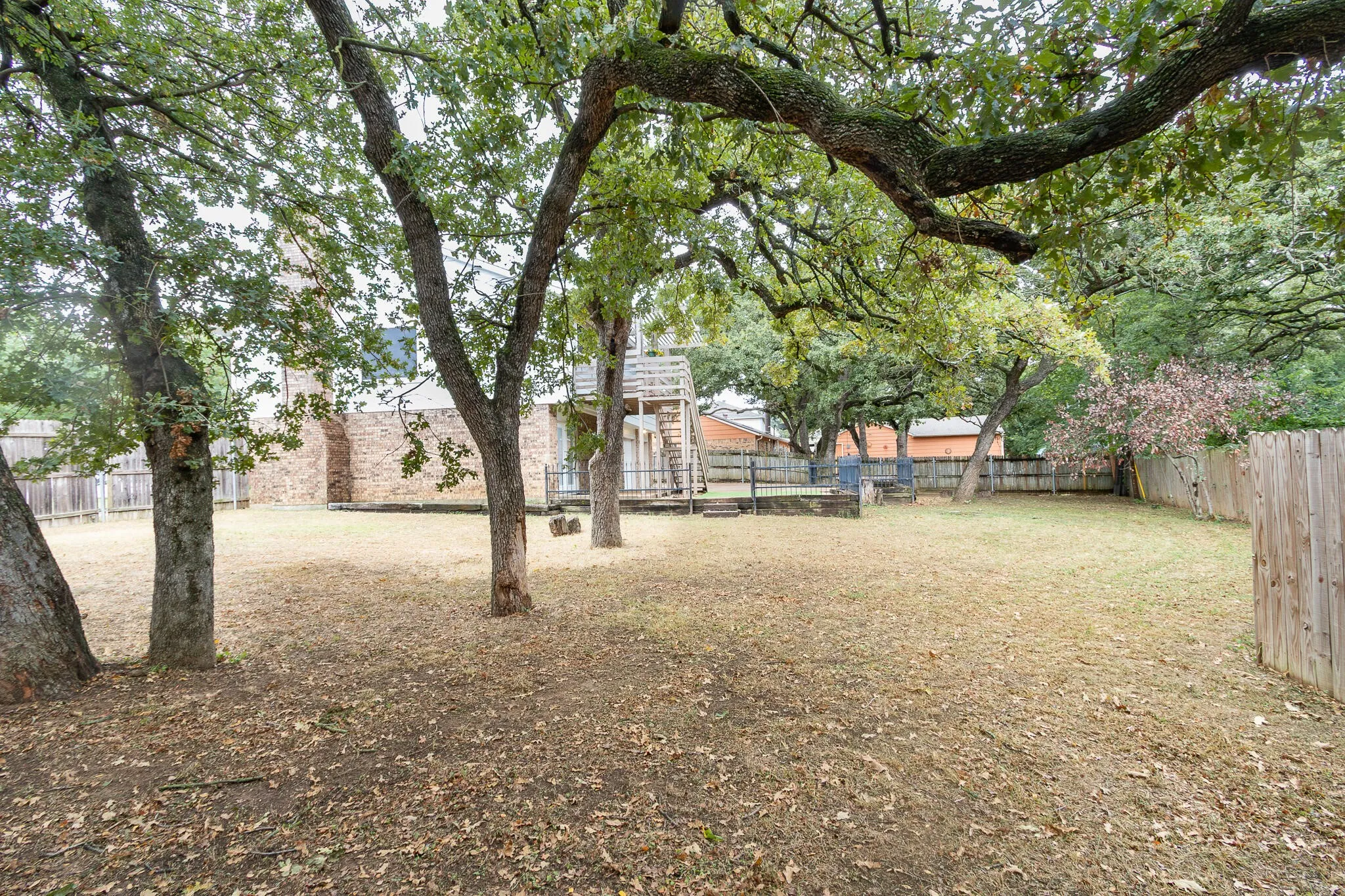 View of fenced backyard