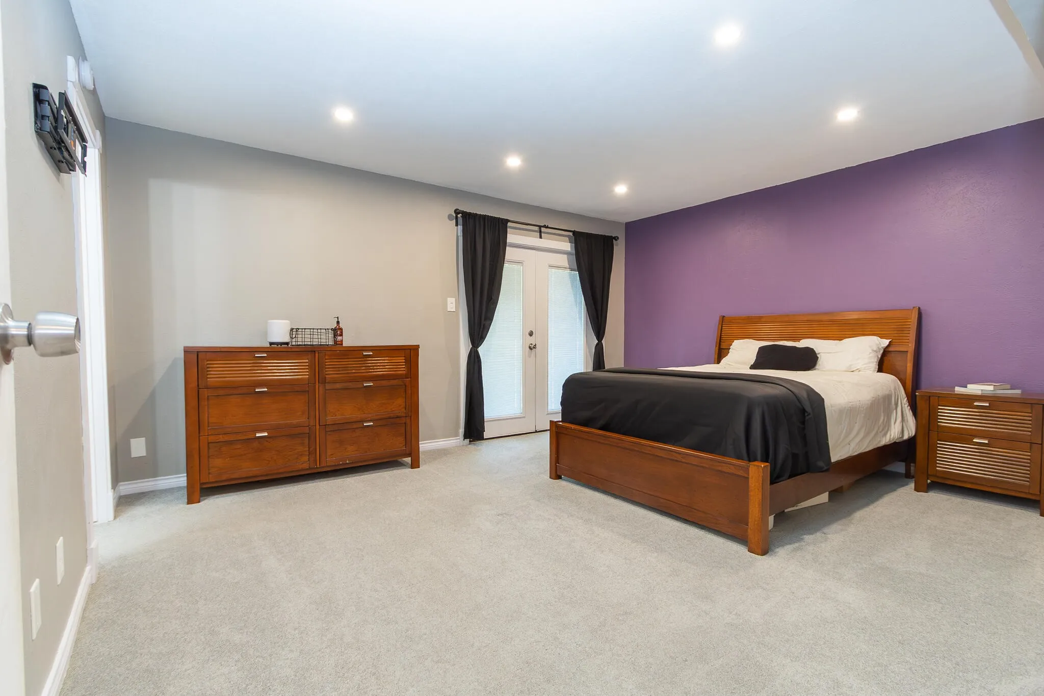 Bedroom featuring access to exterior, carpet, and recessed lighting