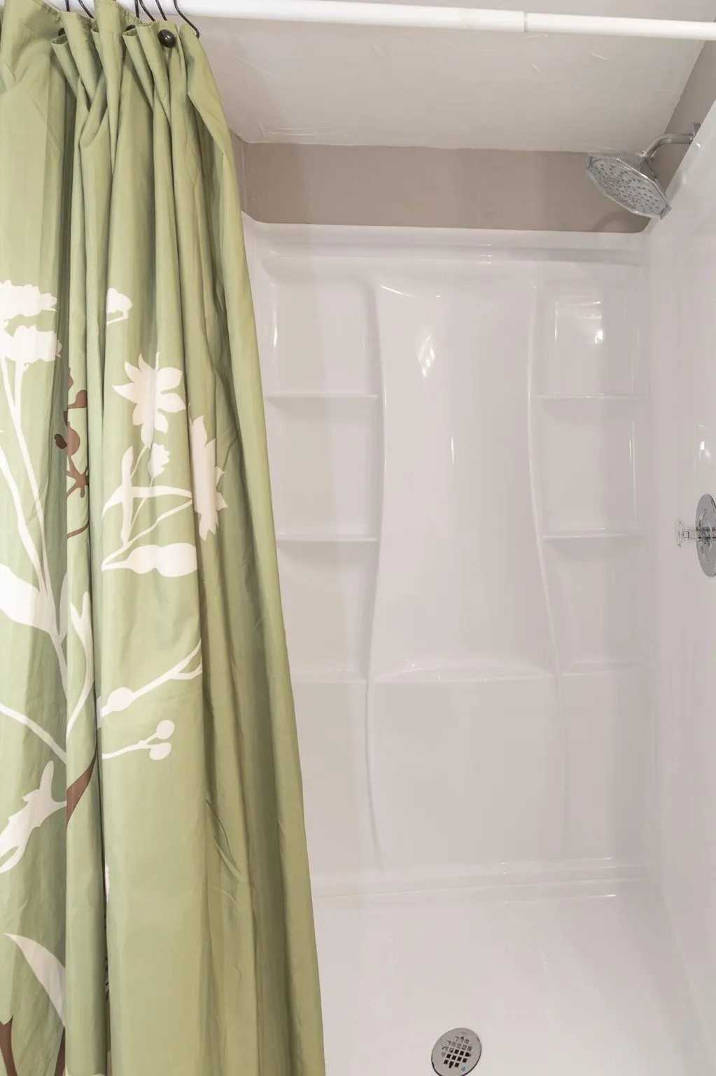 Bathroom featuring a shower with shower curtain