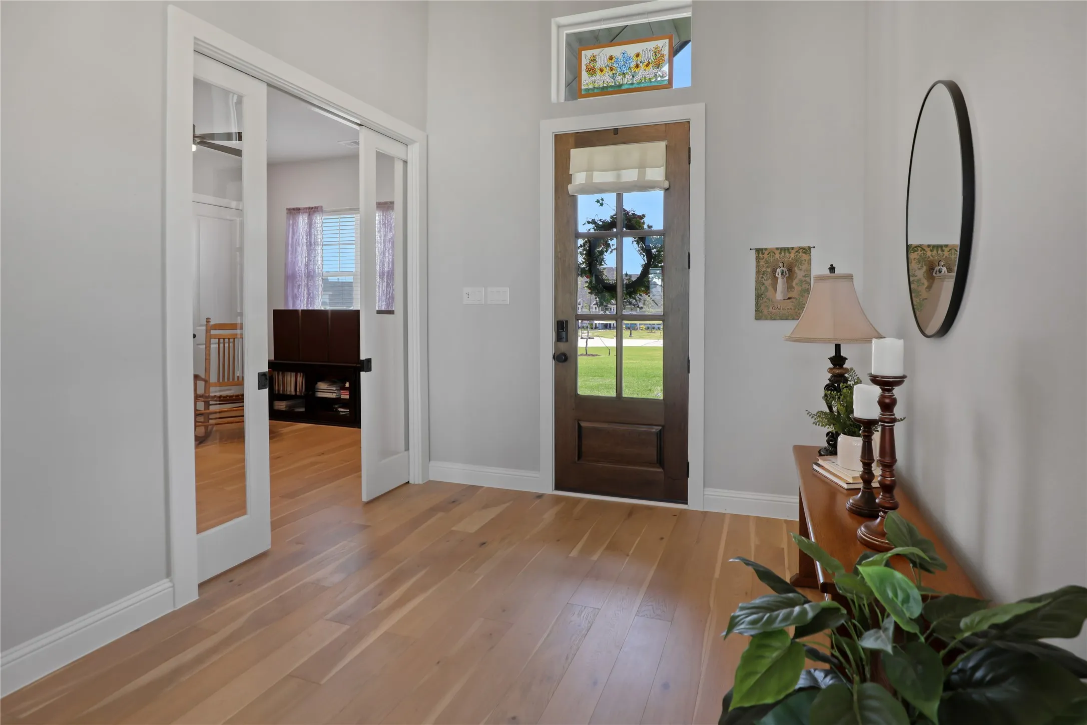 Foyer featuring light wood-type flooring and baseboards