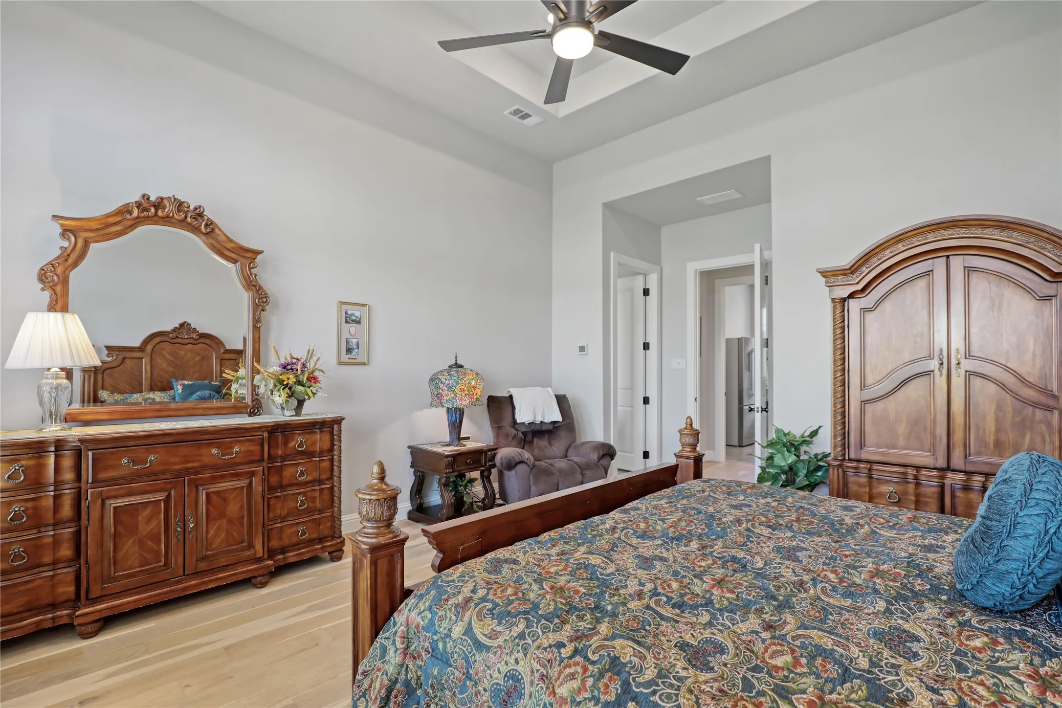 Bedroom featuring light wood-style floors and a ceiling fan