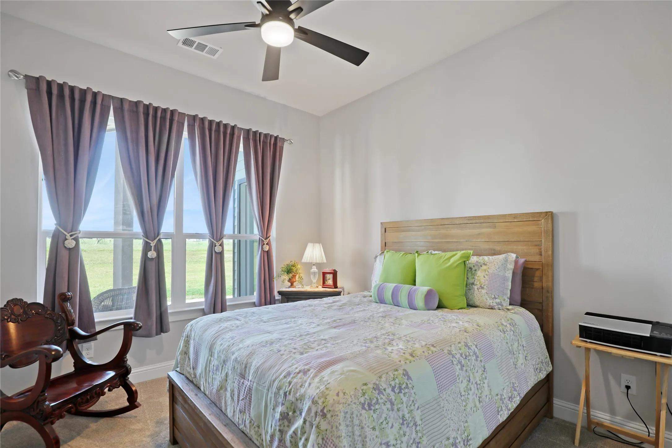 Bedroom with carpet and ceiling fan