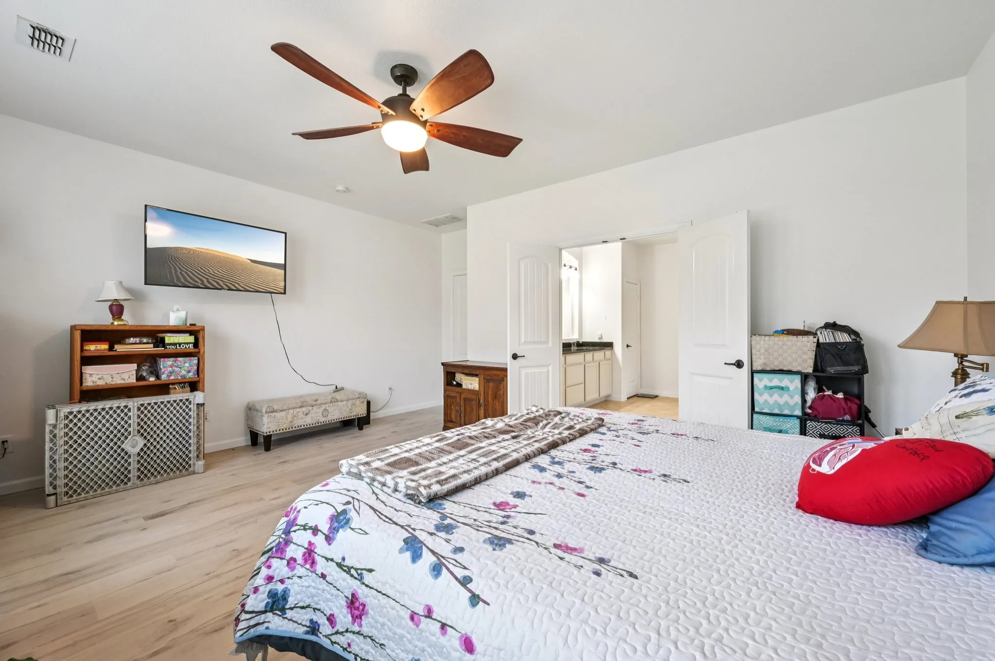 Bedroom featuring light wood-style flooring and a ceiling fan