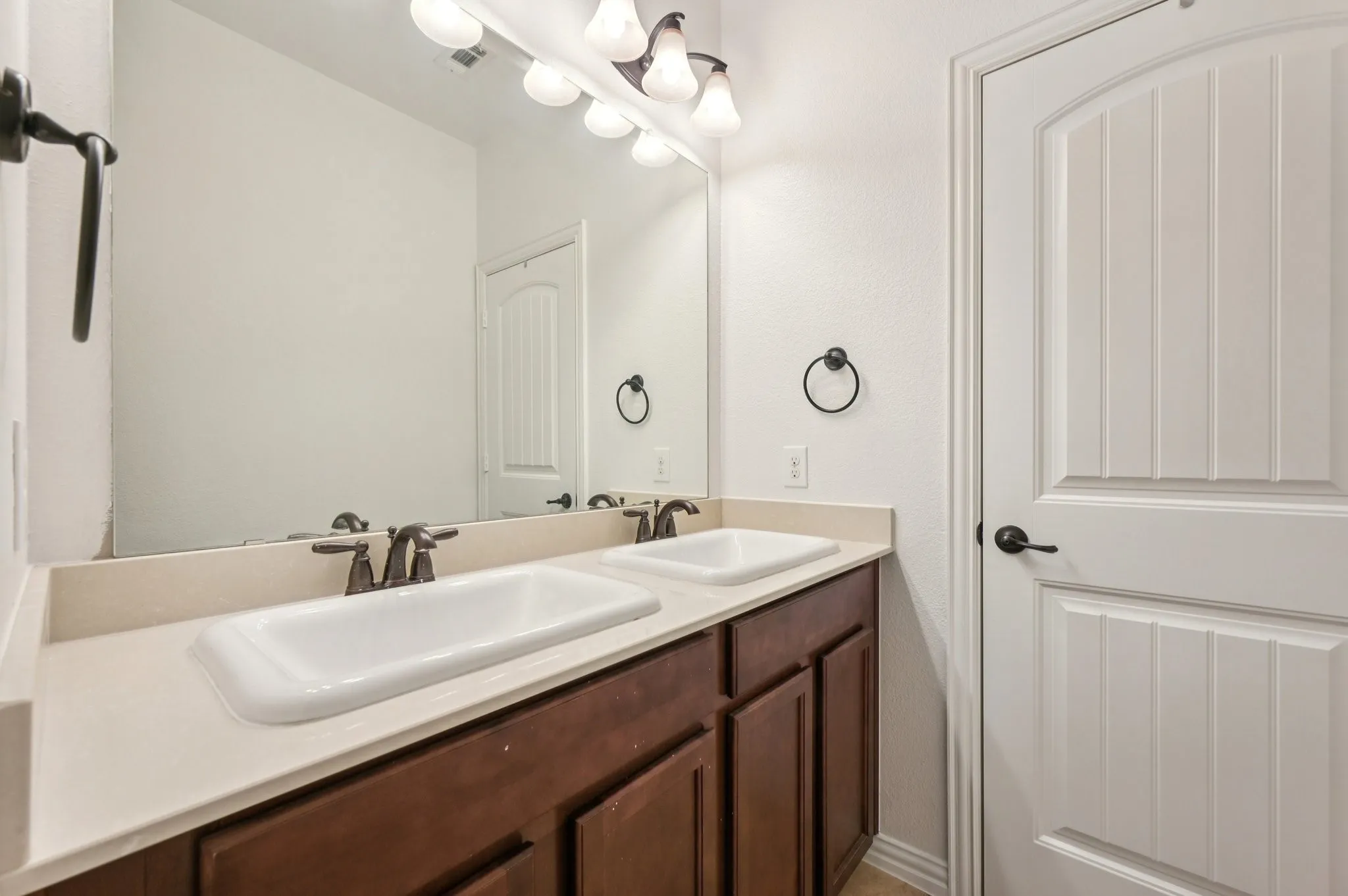 Full bath featuring double vanity