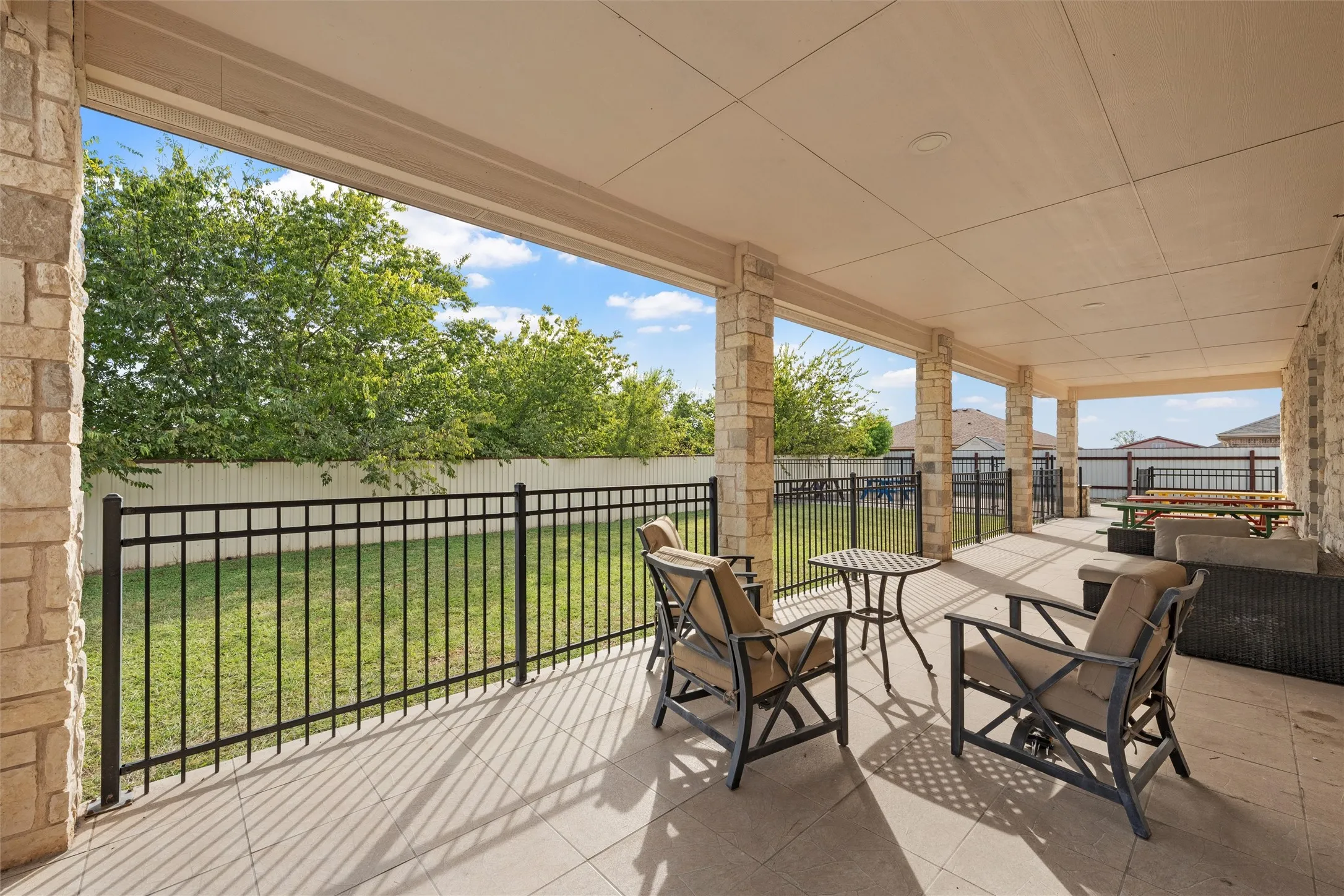 Fenced backyard with a patio area and an outdoor living space