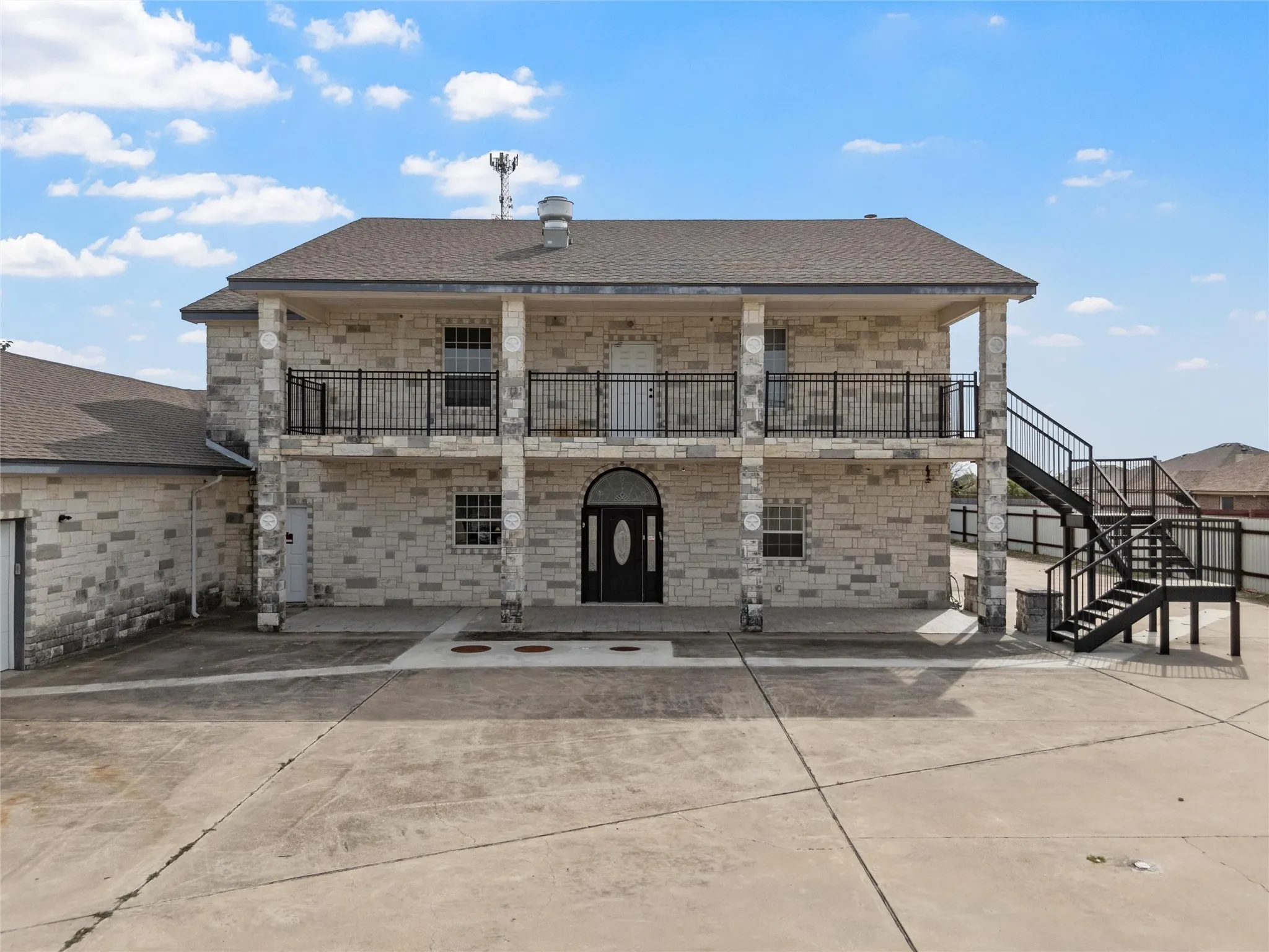 View of building exterior featuring stairs