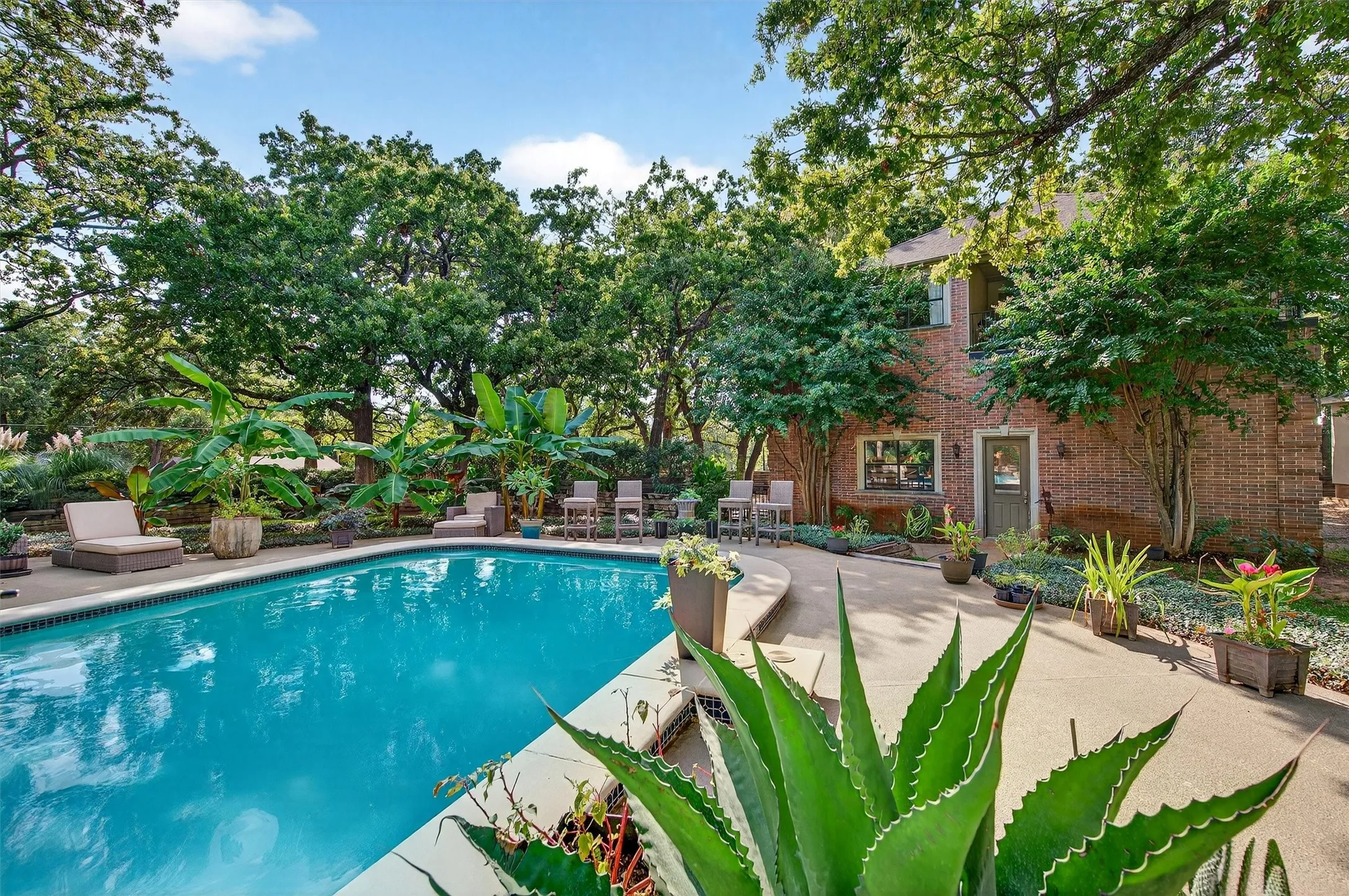 Pool with View of Detached Garage and Guest Quarters