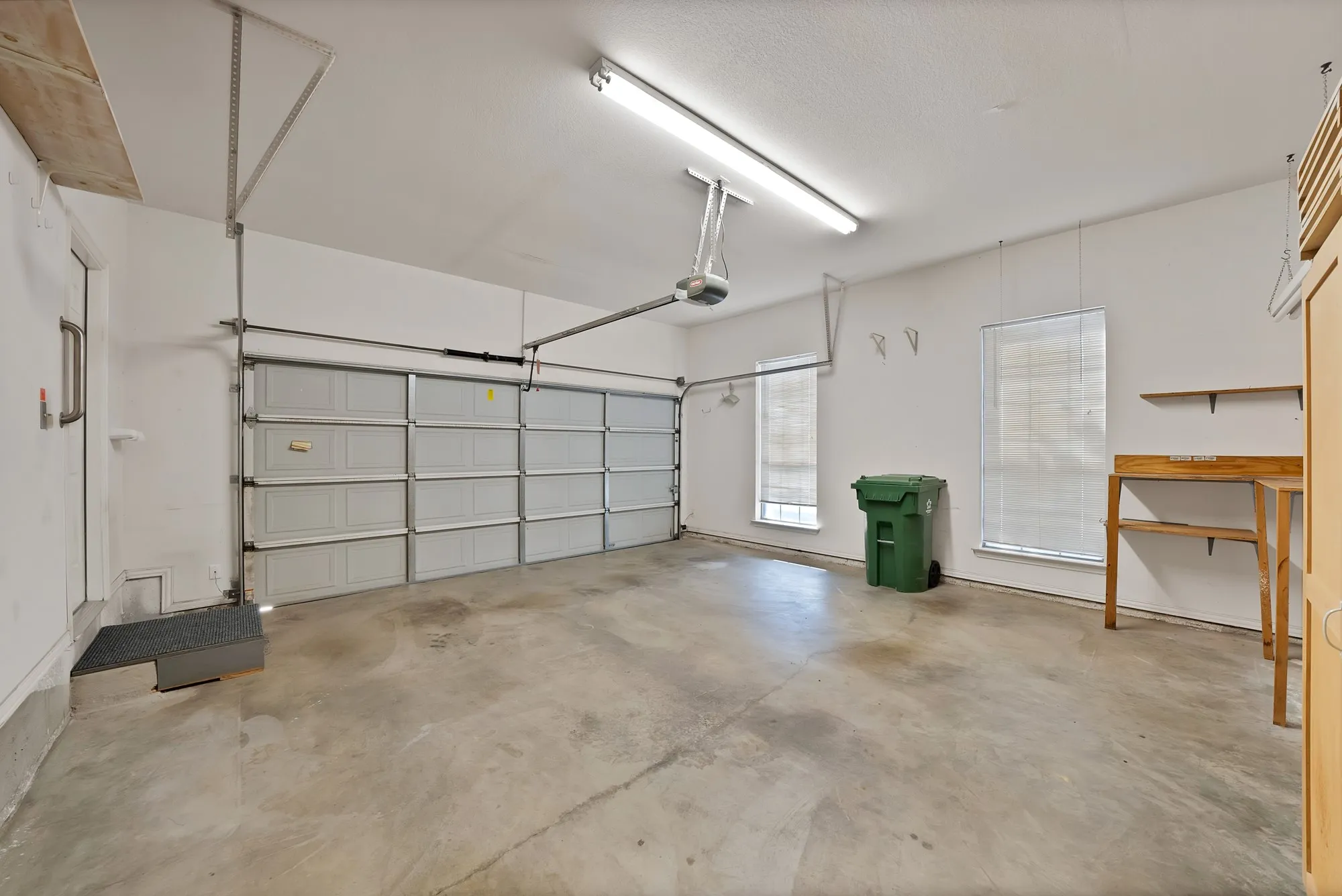 Garage featuring a garage door opener