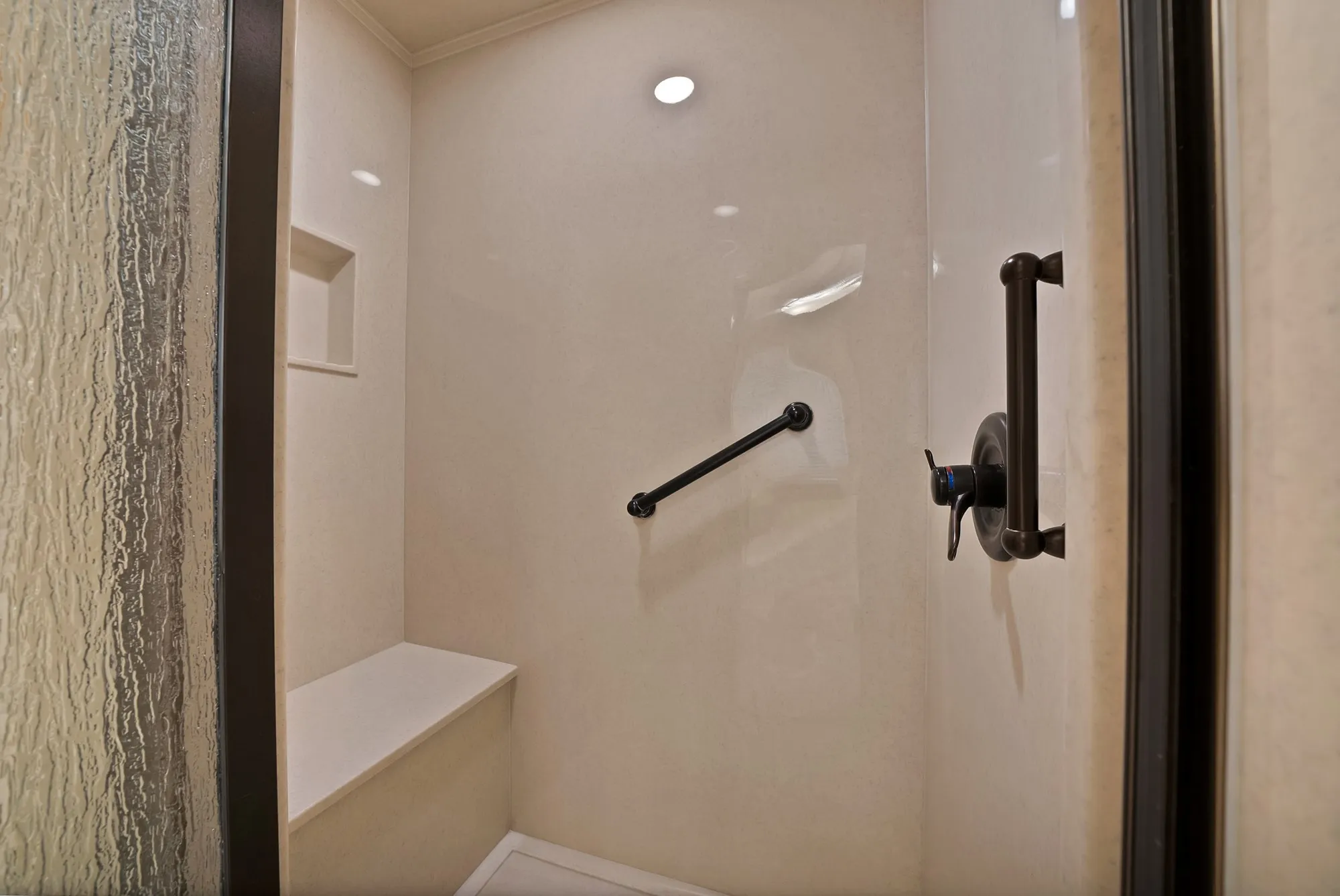 Full bathroom with a stall shower and crown molding